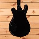 PRS McCarty 594 electric guitar Satin Black showing rear body with cavity cover plates and gloss black neck