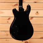 PRS McCarty 594 electric guitar Satin Black showing rear body with cavity cover plates and gloss black neck