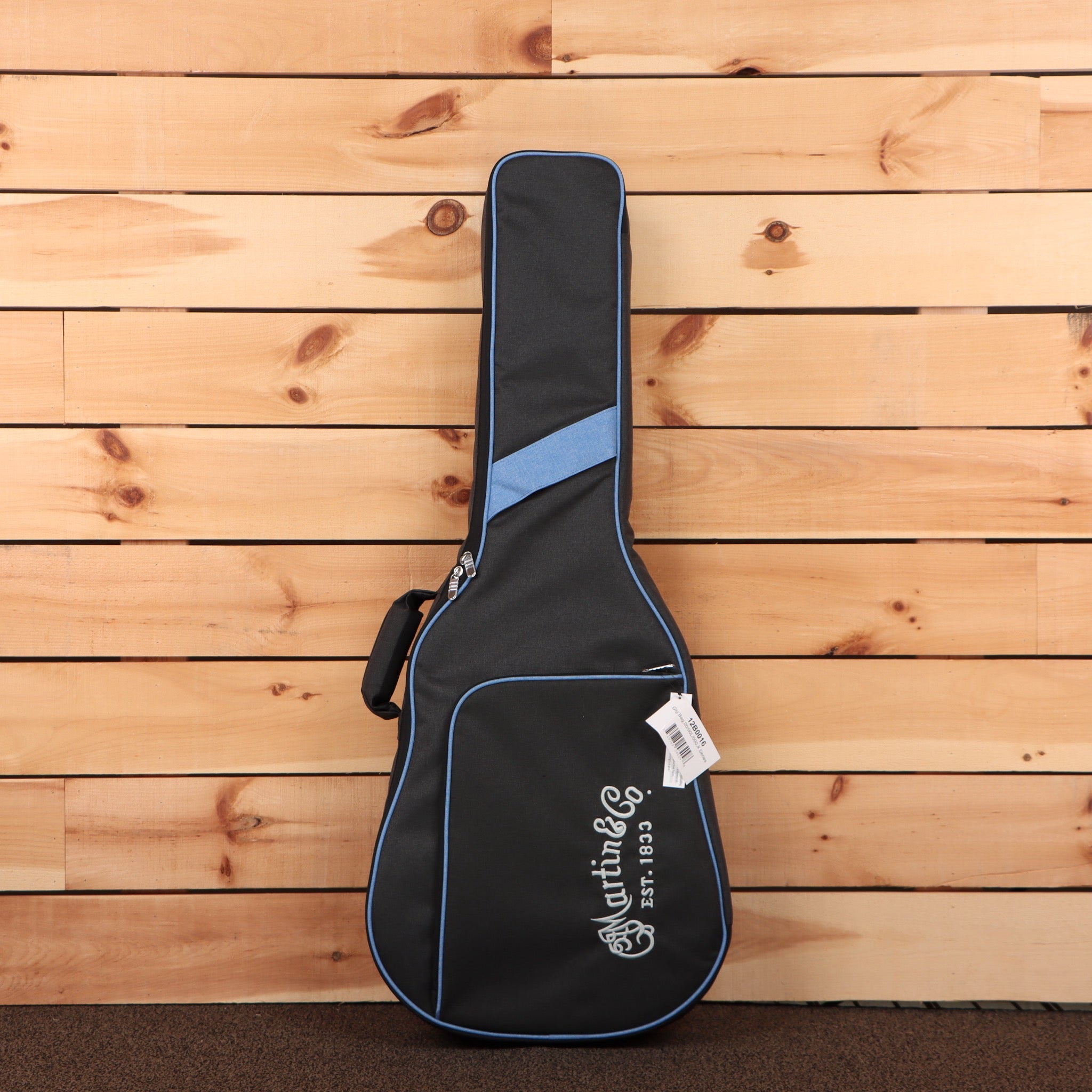 Martin 000X2E concert acoustic guitar natural finish with blue-trimmed gig bag