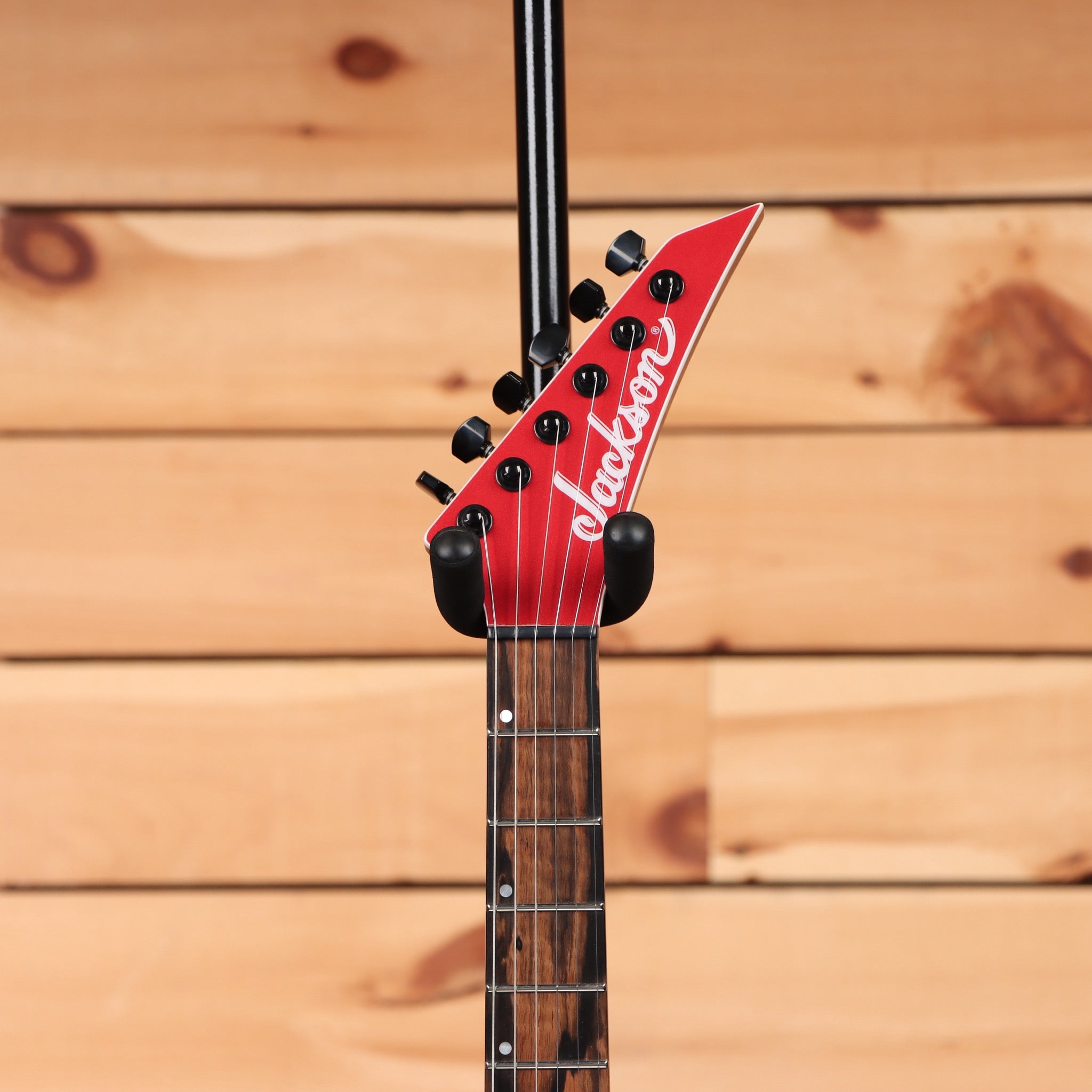 Jackson American Series Virtuoso HT red crystal electric guitar with pointed headstock and black hardware