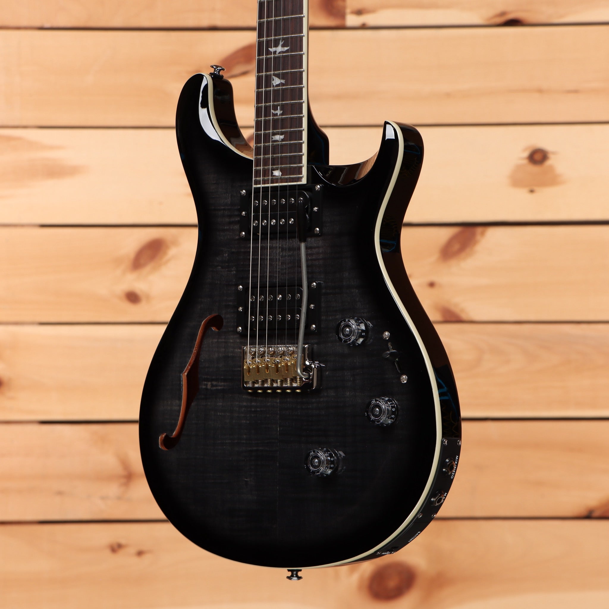 Paul Reed Smith SE Custom 24 semi-hollow electric guitar Charcoal Burst with gold hardware and f-hole design