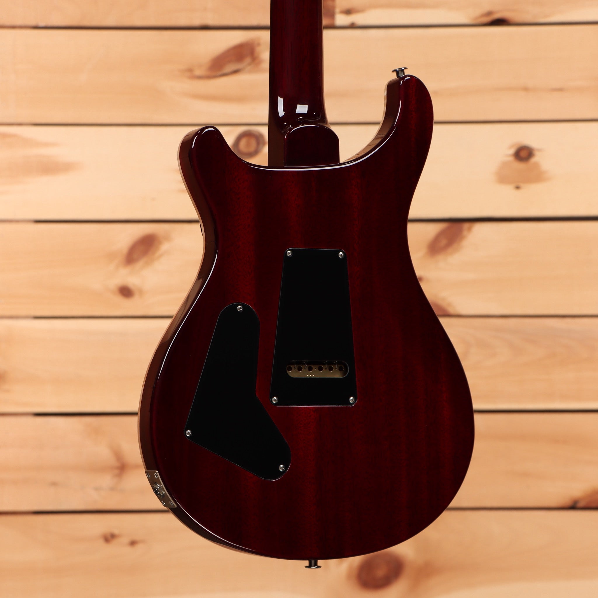 Paul Reed Smith Custom 24 Dark Cherry Sunburst electric guitar with humbucker pickups and black pickguard