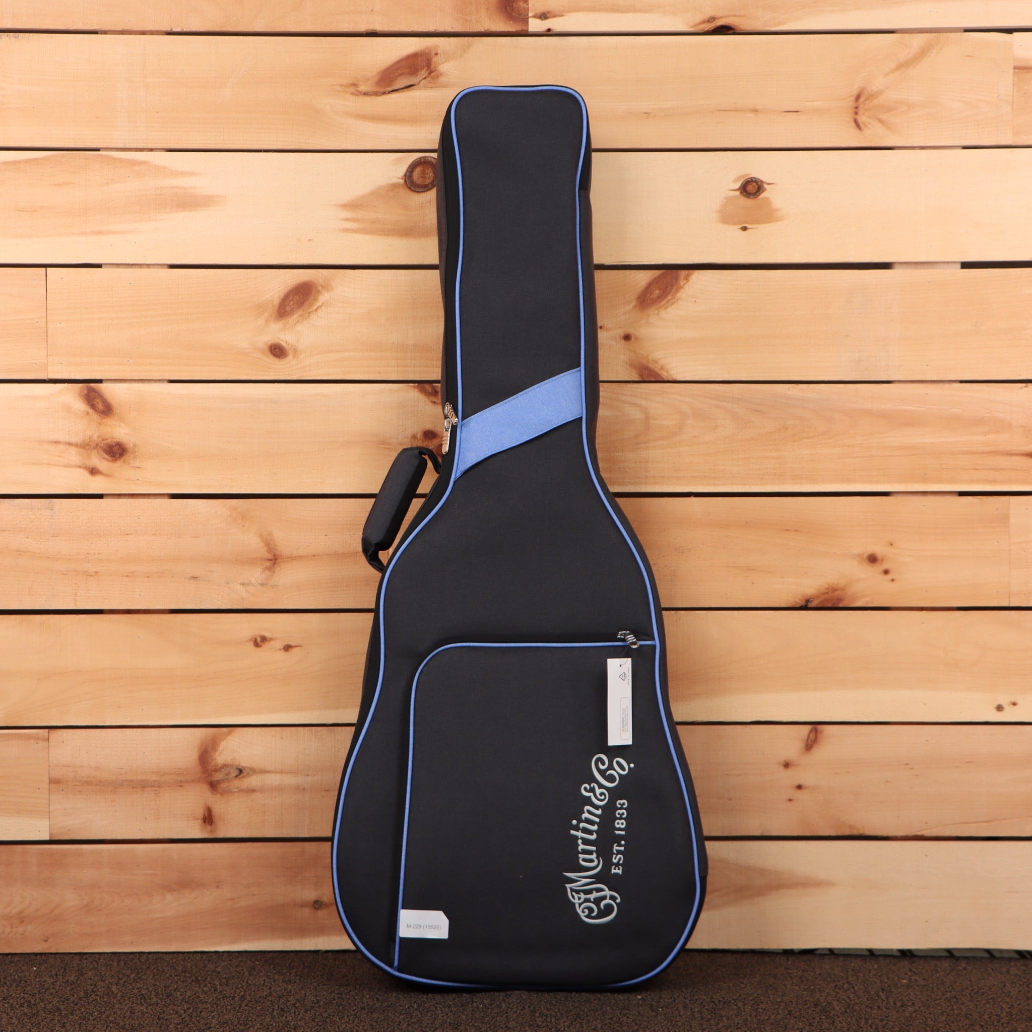 Martin DX2E Brazilian 12-string acoustic guitar gig bag with blue piping and carry handle