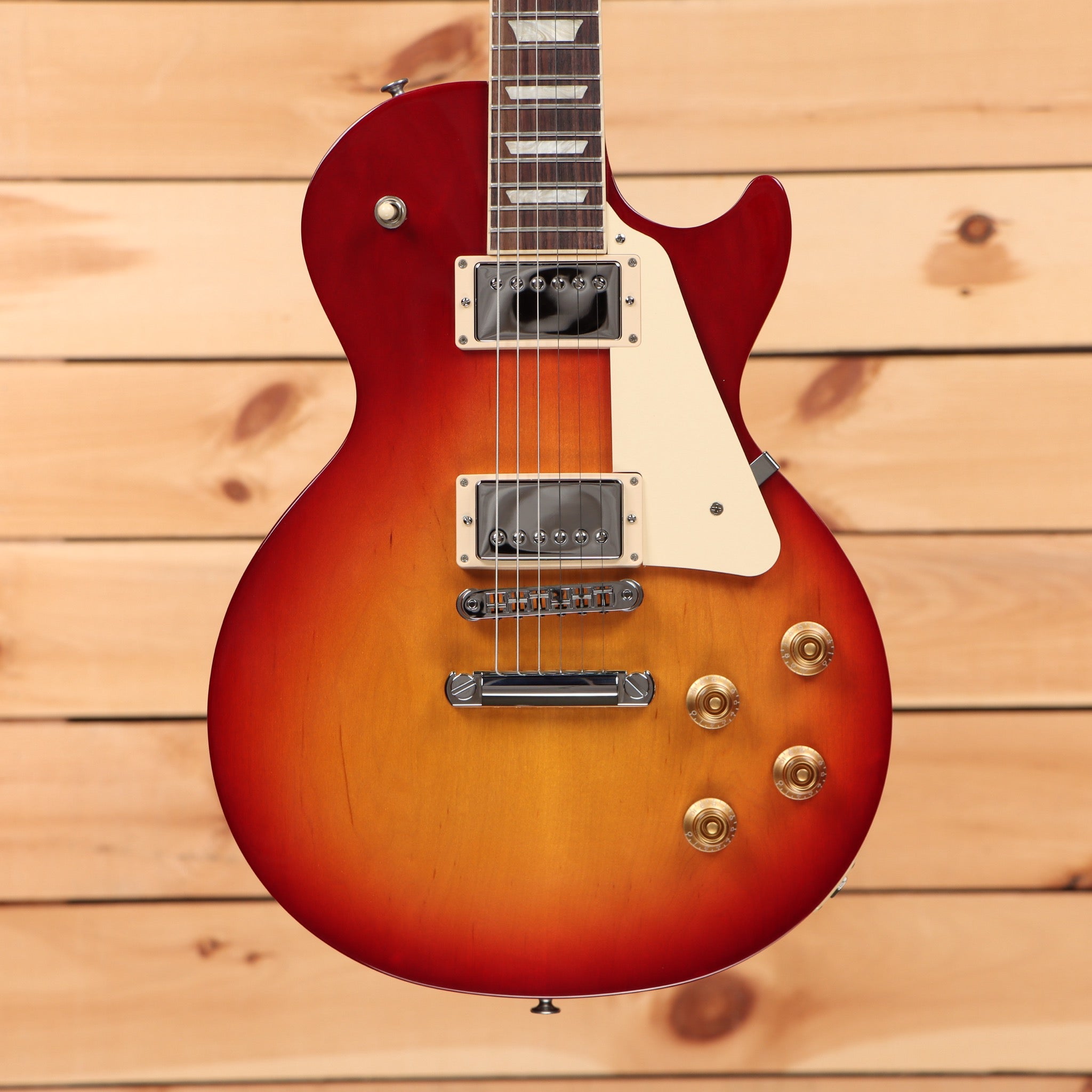 Gibson Les Paul Studio Heritage Cherry Sunburst electric guitar with dual humbucker pickups and gold hardware