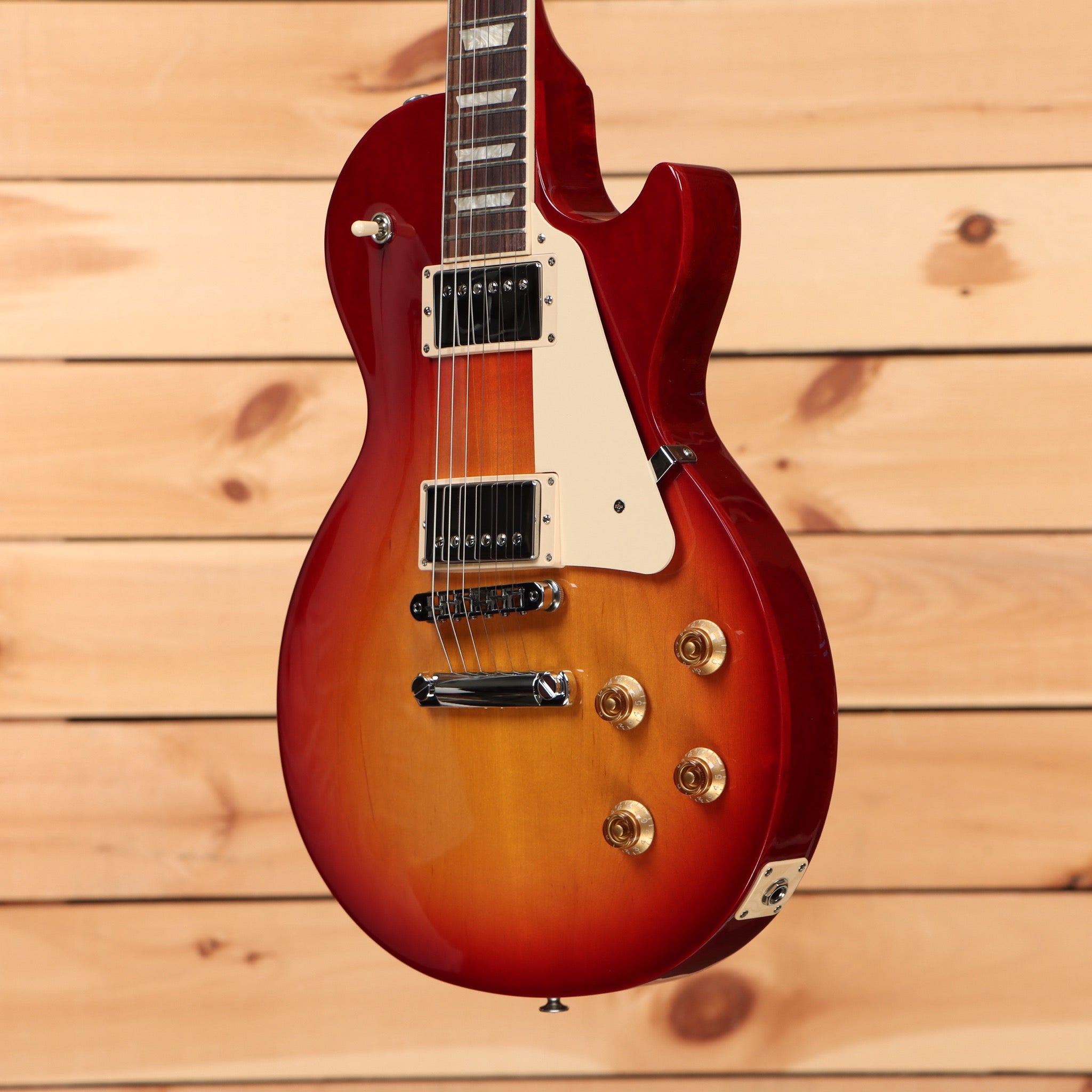 Gibson Les Paul Studio Heritage Cherry Sunburst electric guitar with dual humbucker pickups and gold hardware