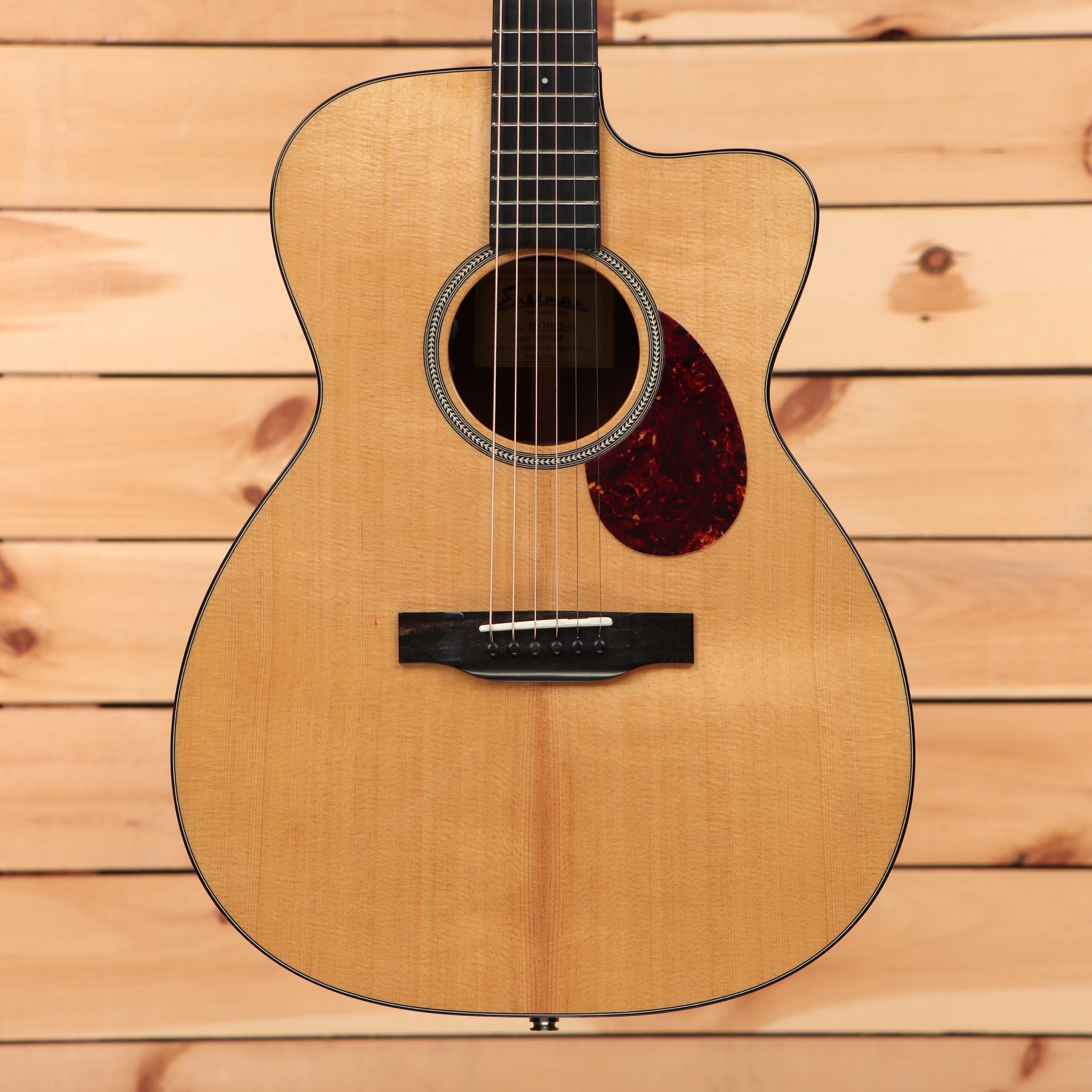 Eastman E1OMC Special acoustic guitar natural finish with cutaway and tortoiseshell pickguard