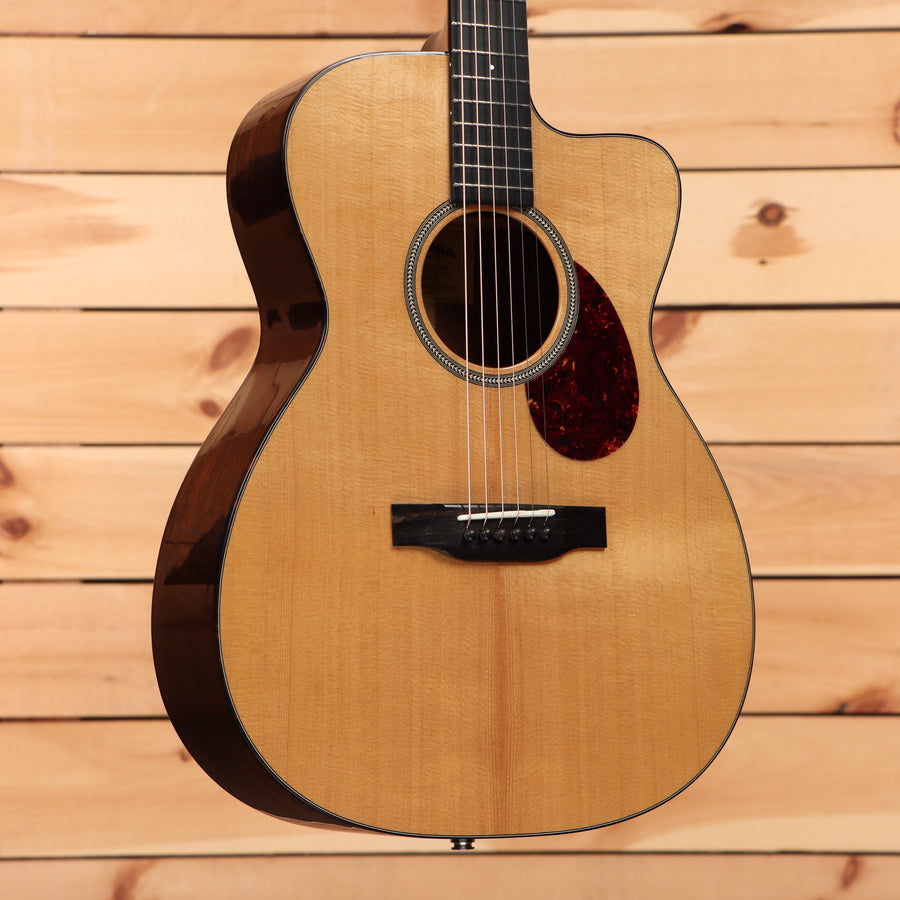 Eastman E1OMC Special acoustic guitar natural finish with cutaway and tortoiseshell pickguard