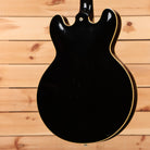 Pre-owned Gibson ES-335 semi-hollow electric guitar Ebony with gold binding and f-holes