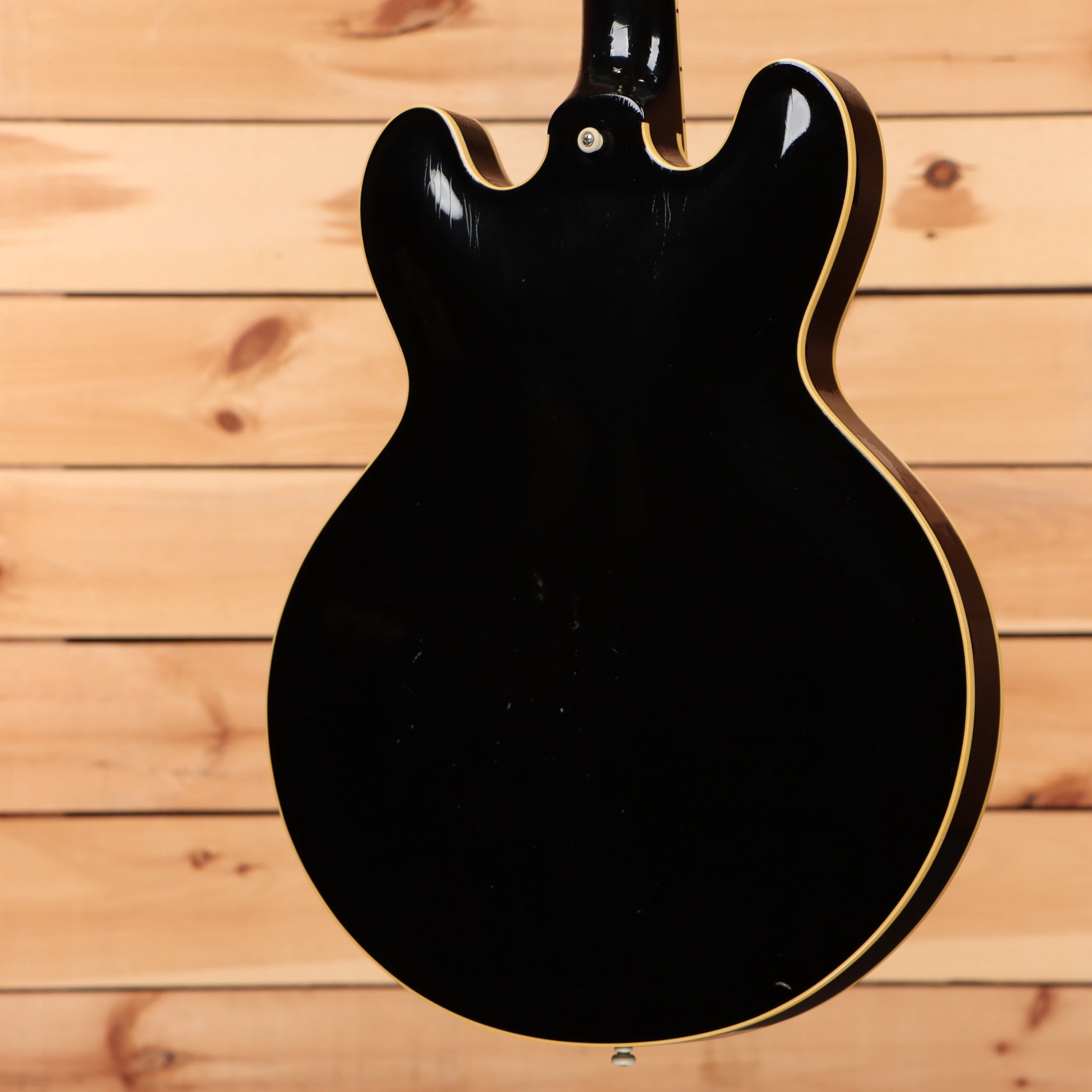 Pre-owned Gibson ES-335 semi-hollow electric guitar Ebony with gold binding and f-holes