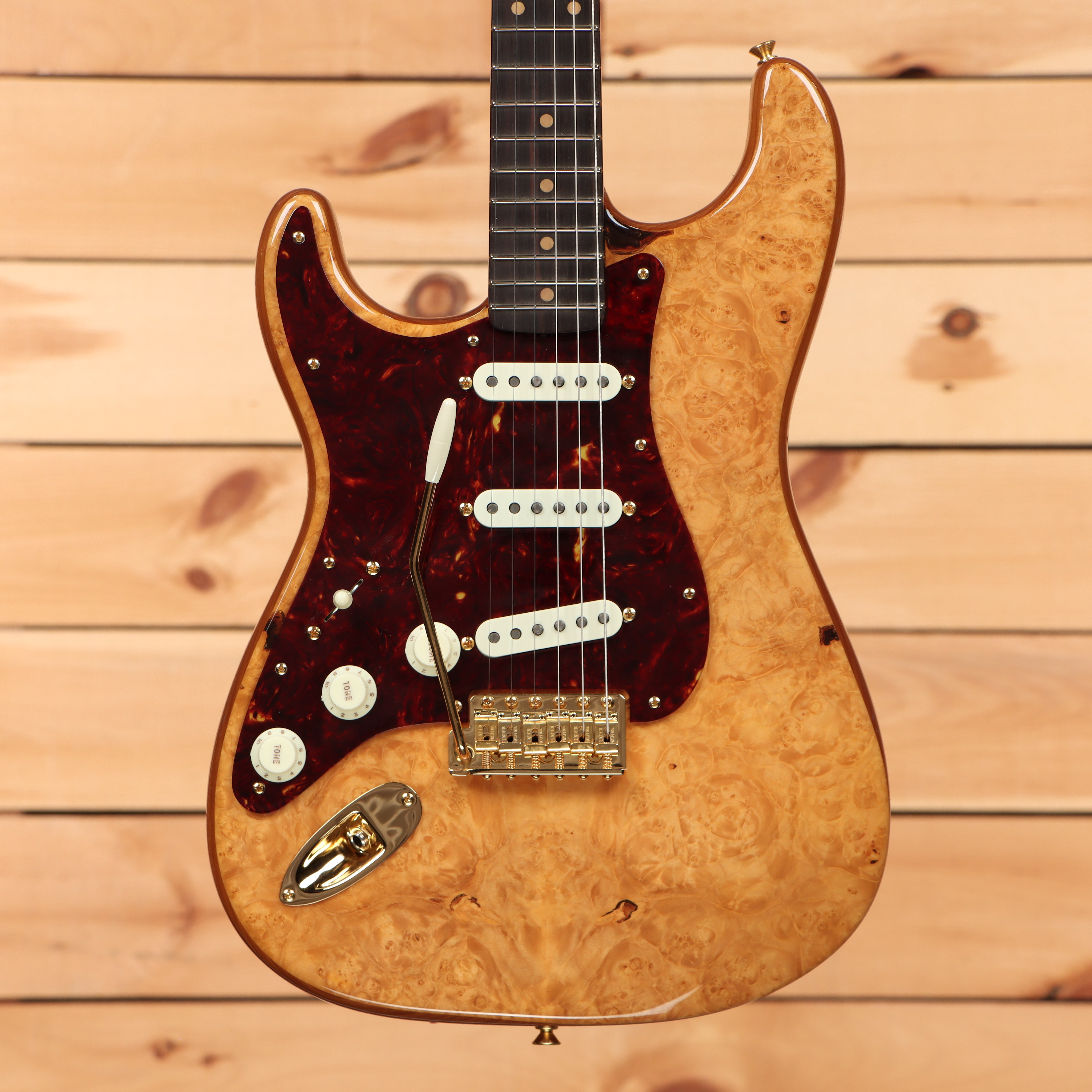 Fender Custom Shop Artisan Maple Burl Stratocaster electric guitar aged natural with tortoiseshell pickguard and single-coil pickups