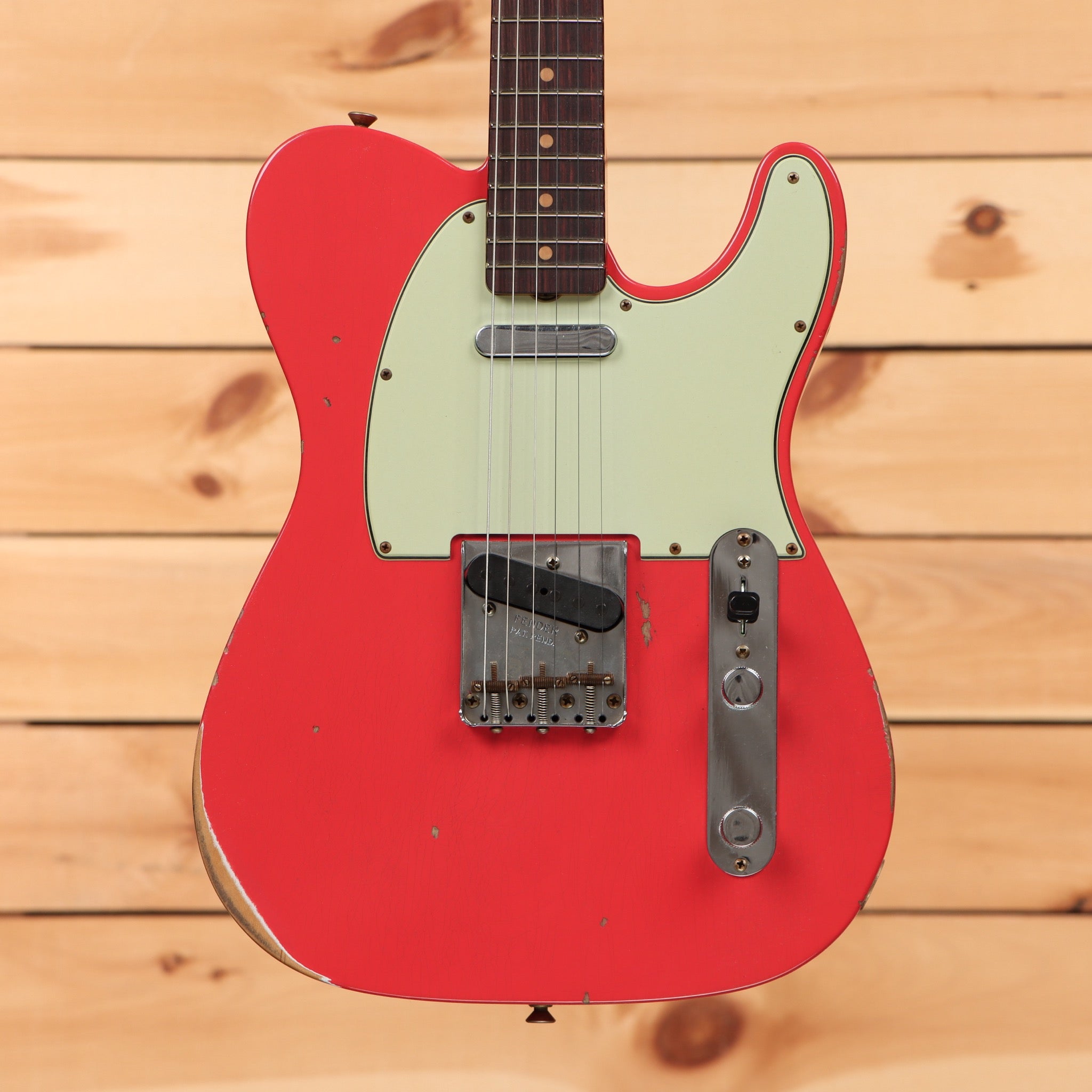 Fender Custom Shop 1963 Telecaster Relic electric guitar Fiesta Red with single-coil pickup and aged patina