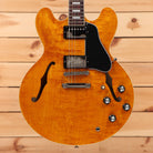 Gibson ES-335 semi-hollow electric guitar Figured Honey Amber with dual humbuckers and f-holes