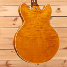 Gibson ES-335 semi-hollow electric guitar Figured Honey Amber with white binding and f-holes