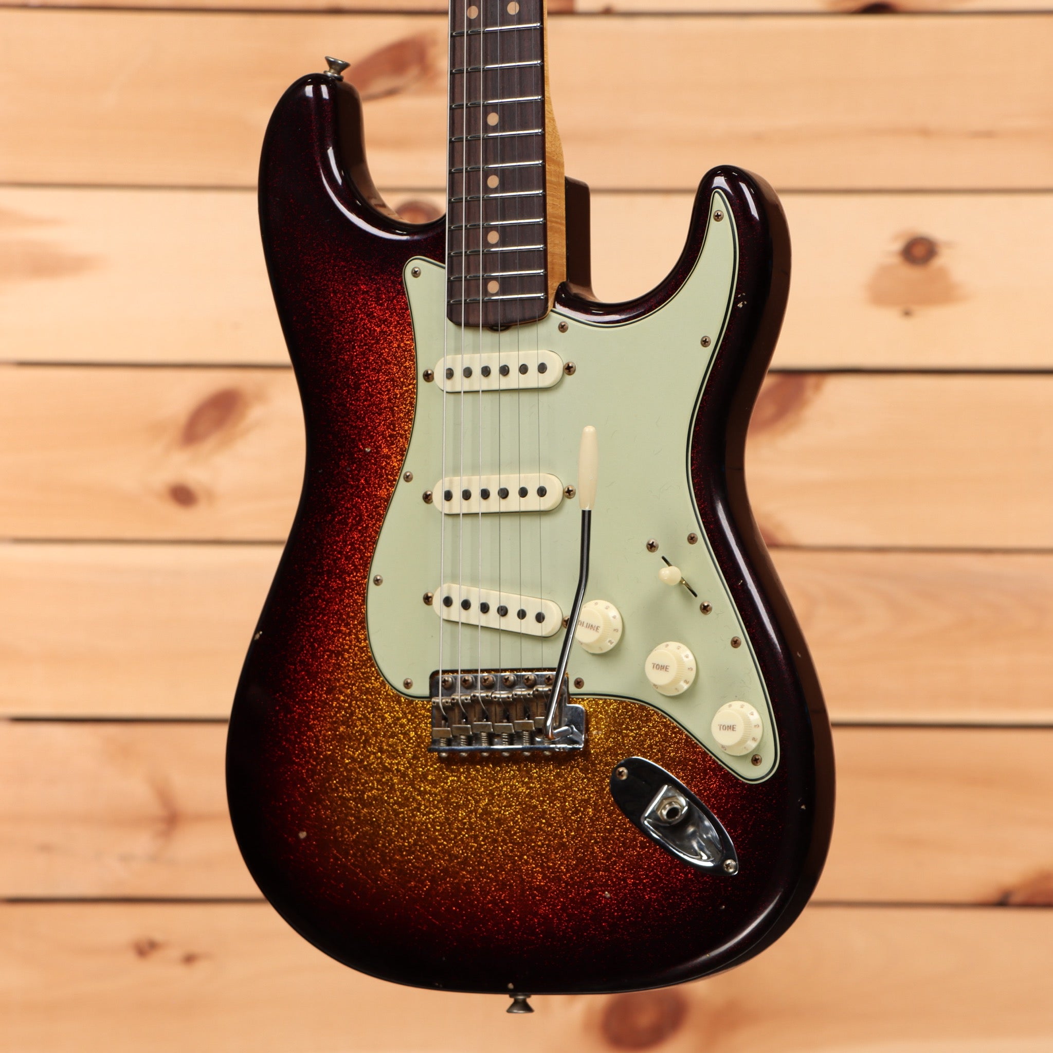 Fender Custom Shop 1963 Sparkle Stratocaster Journeyman Relic 3-Color Sunburst electric guitar with mint green pickguard