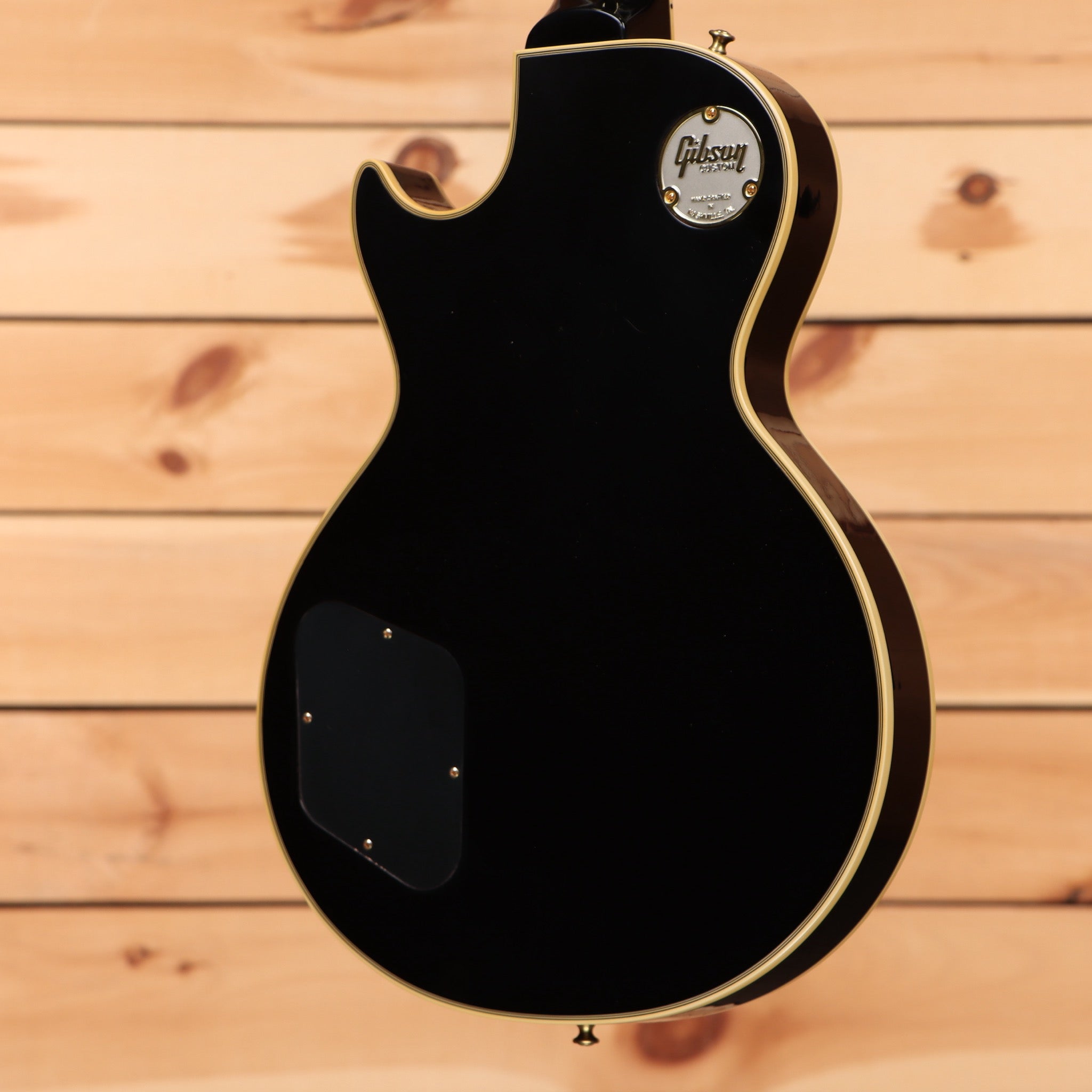 Gibson 1957 Les Paul Custom Reissue electric guitar Ebony VOS with gold binding and dual humbuckers