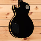 Gibson 1957 Les Paul Custom Reissue electric guitar Ebony VOS finish with dual humbuckers and gold binding