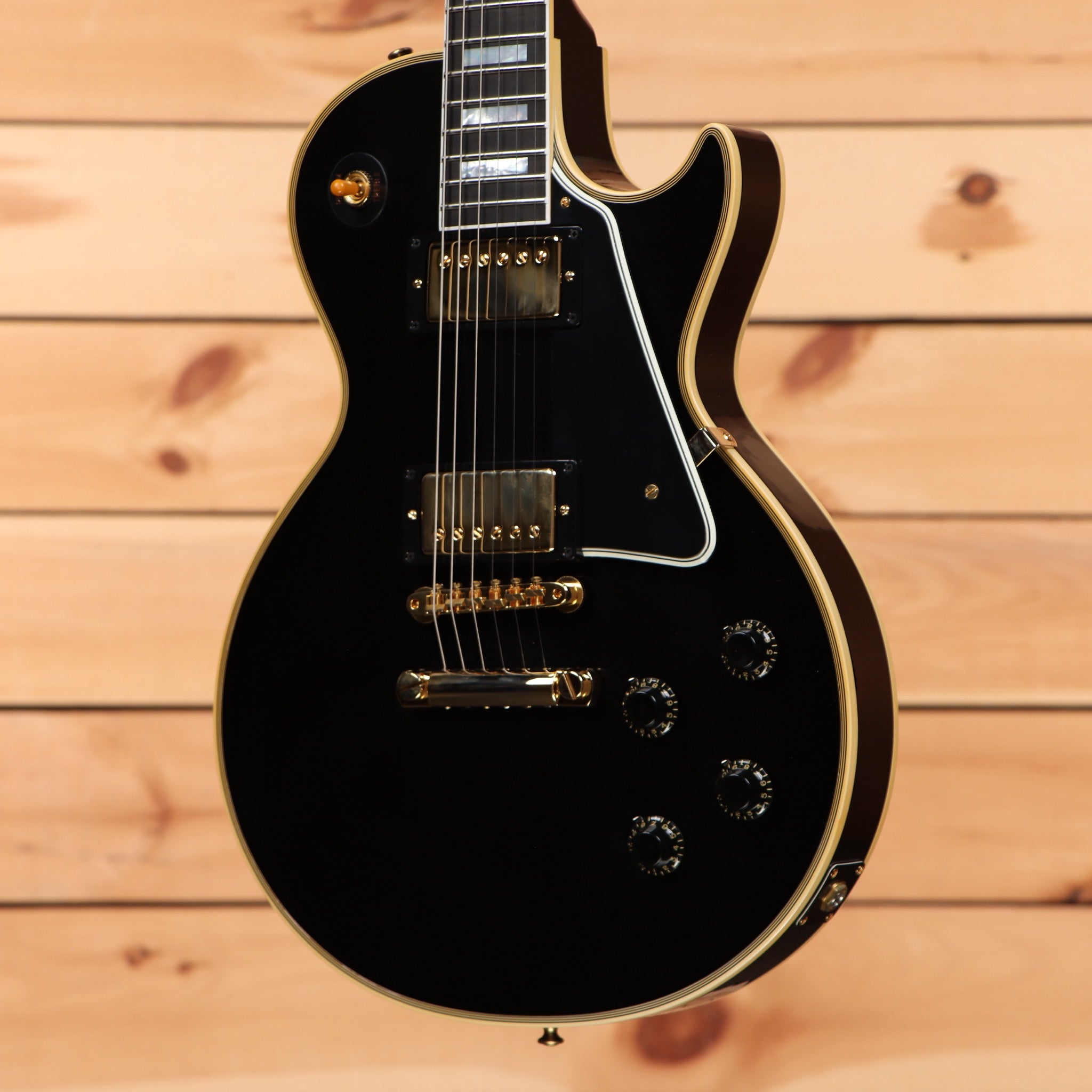 Gibson 1957 Les Paul Custom Reissue electric guitar Ebony VOS with gold hardware and dual humbuckers