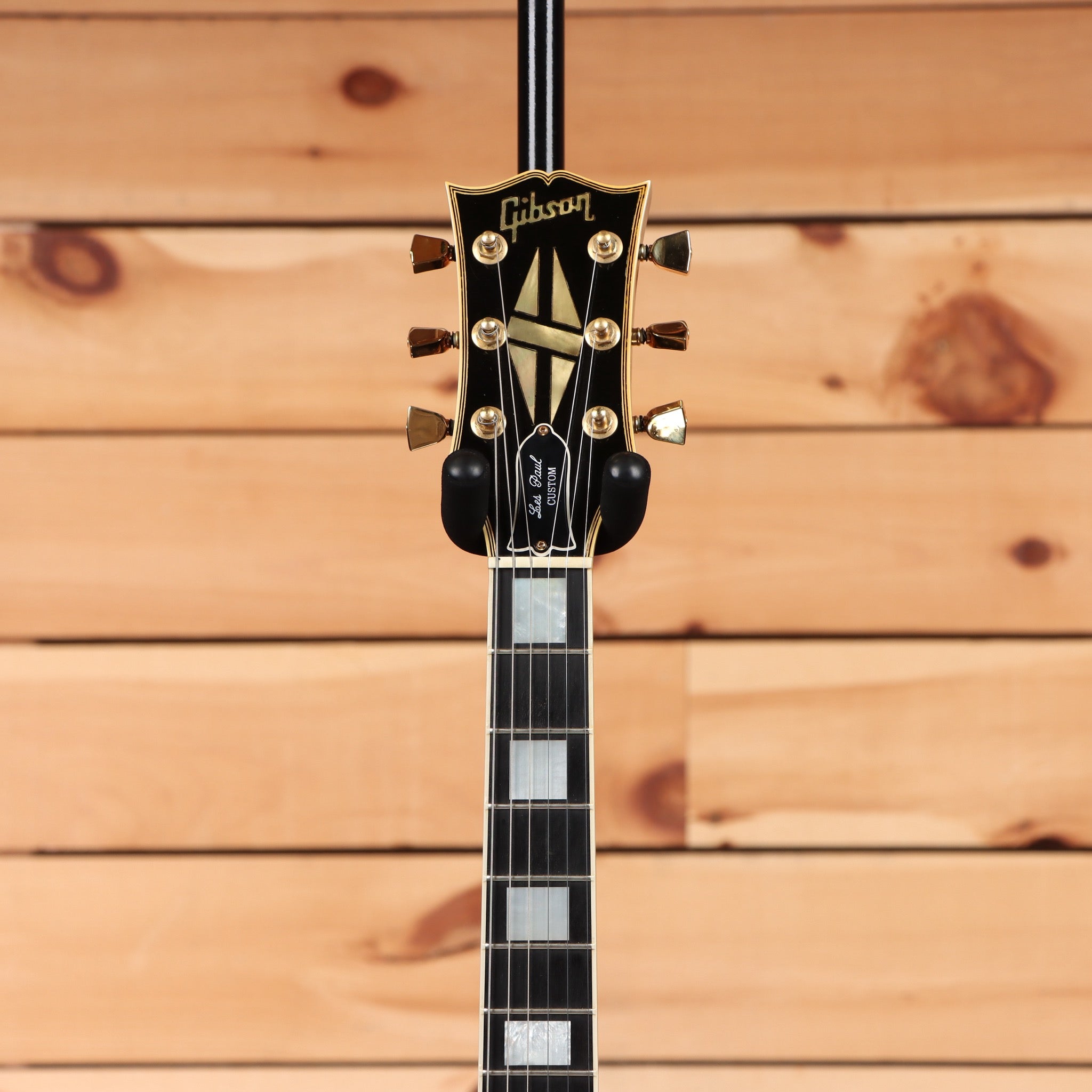 Pre-owned Gibson 1988 Les Paul Custom ebony electric guitar with gold hardware and maple neck