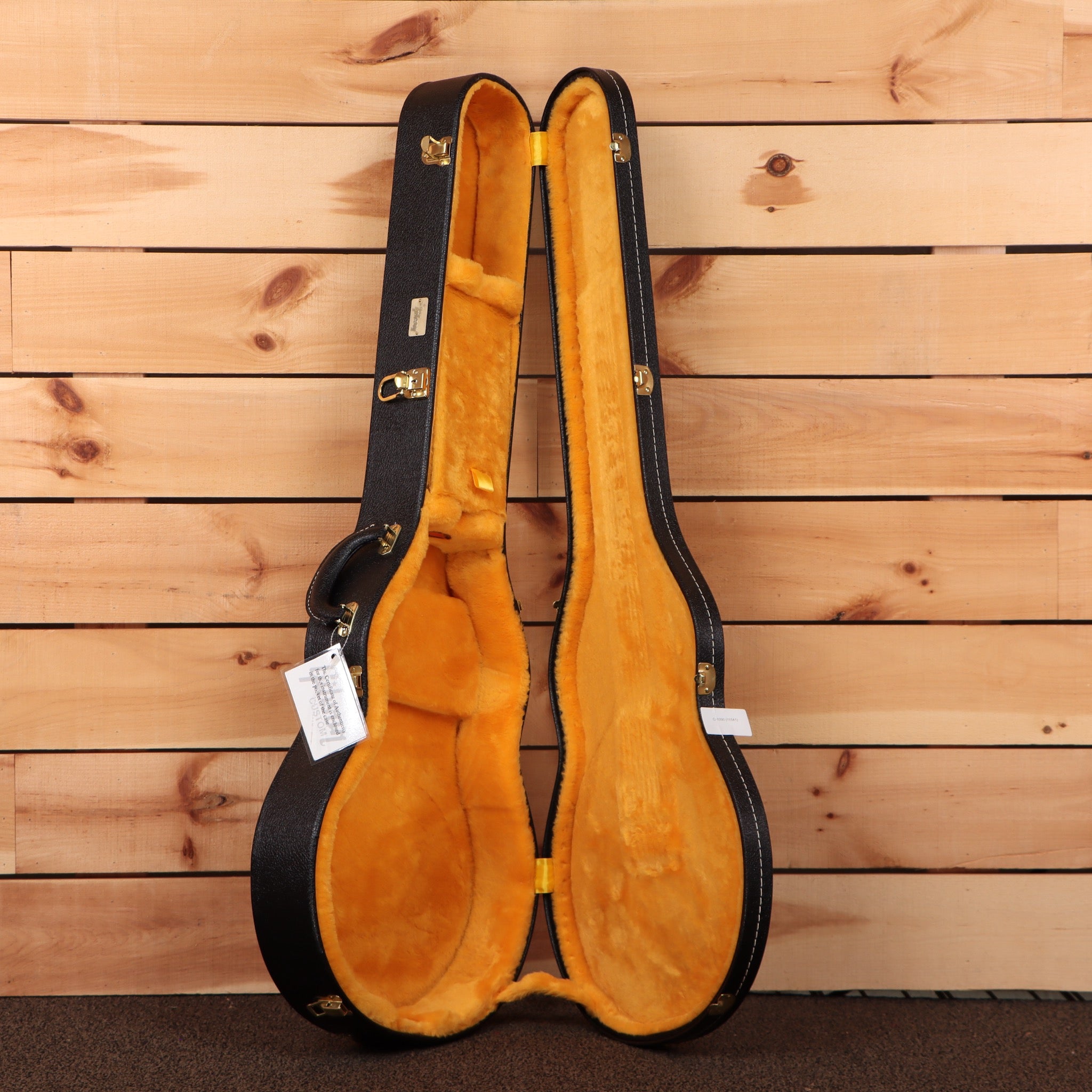 Gibson Les Paul Custom Ebony electric guitar hardcase with orange velvet interior and gold hardware