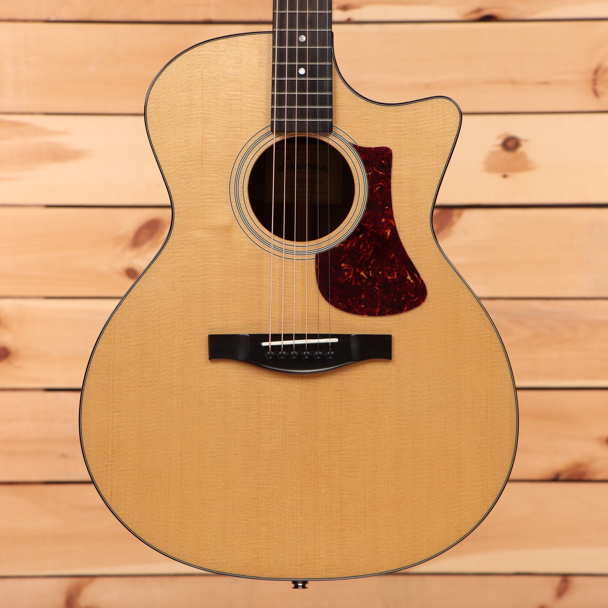 Eastman AC1221CEDLX natural acoustic guitar with venetian cutaway and red tortoiseshell pickguard