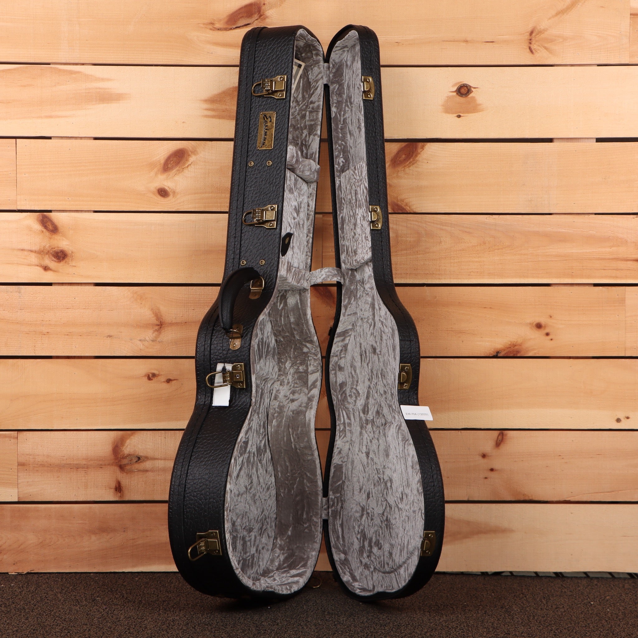 Eastman E6OMTC acoustic guitar natural finish with gray velvet case interior and brass hardware