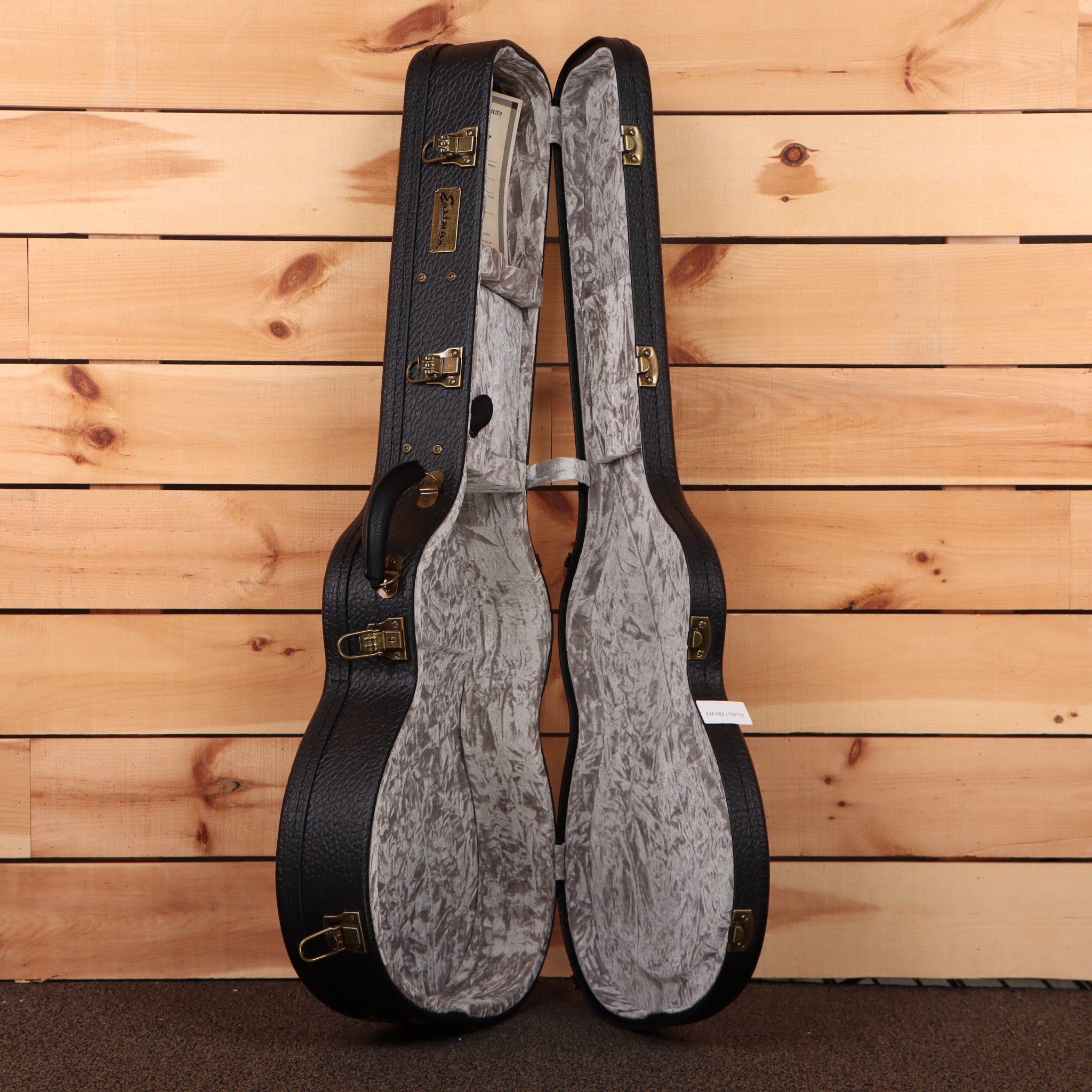 Eastman E10OMTC acoustic guitar natural finish with gray velvet-lined case and gold hardware