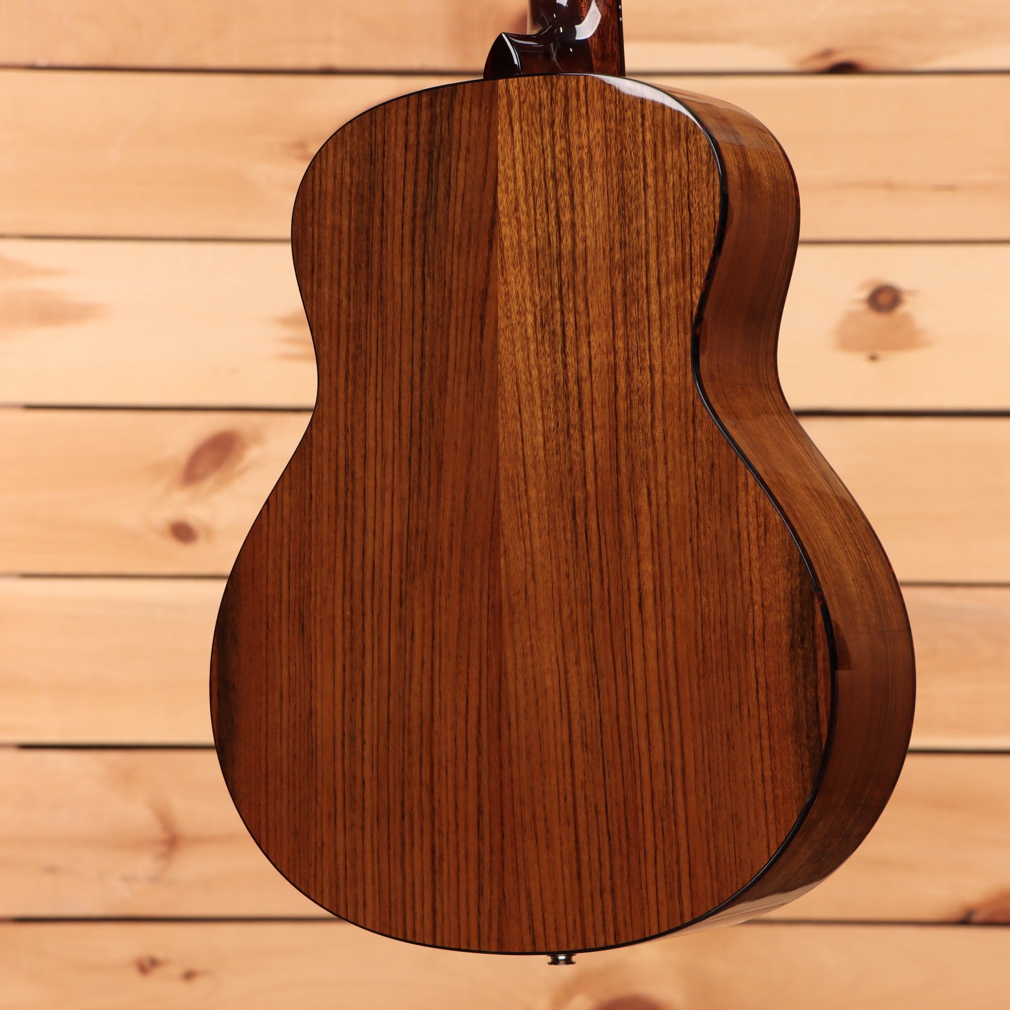 Eastman ACTG2EDLX acoustic guitar natural finish with wood grain detail back view