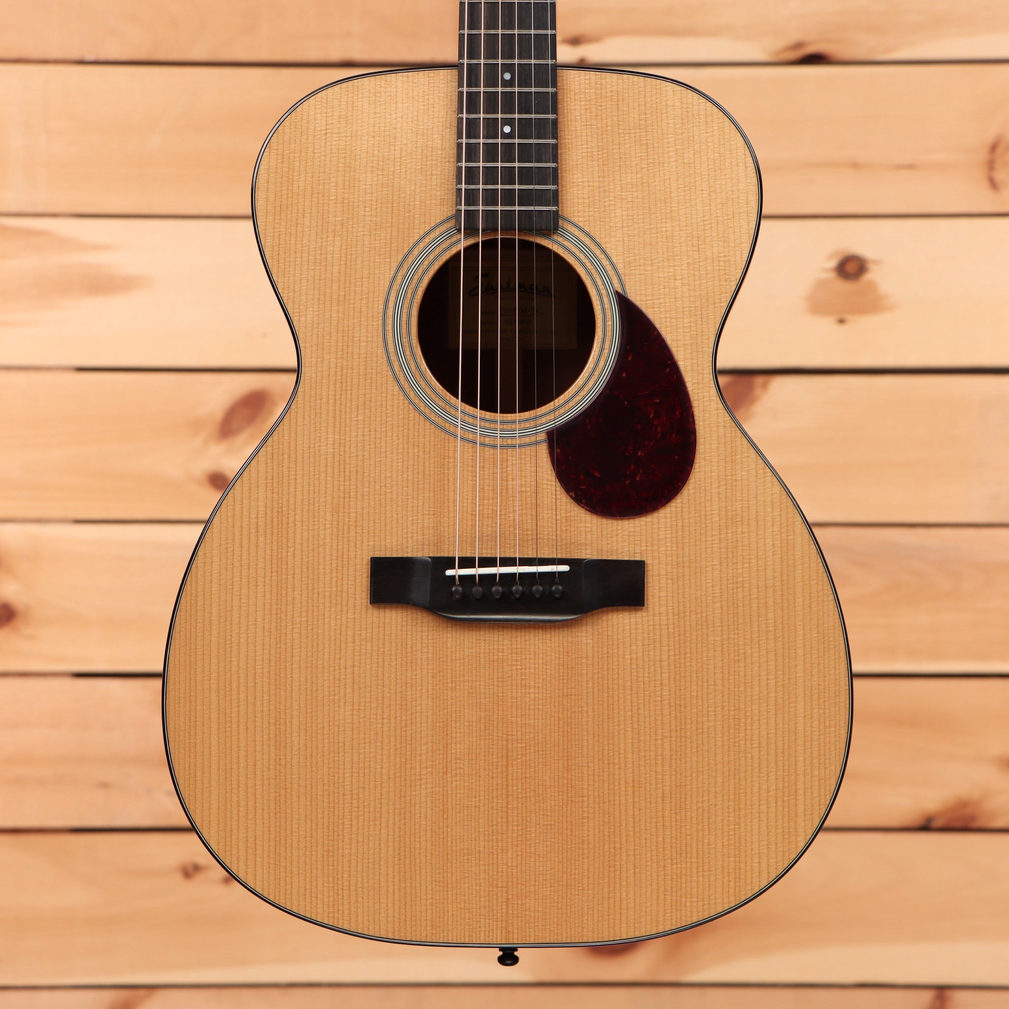 Eastman E10OM-TC acoustic guitar natural finish with tortoiseshell pickguard