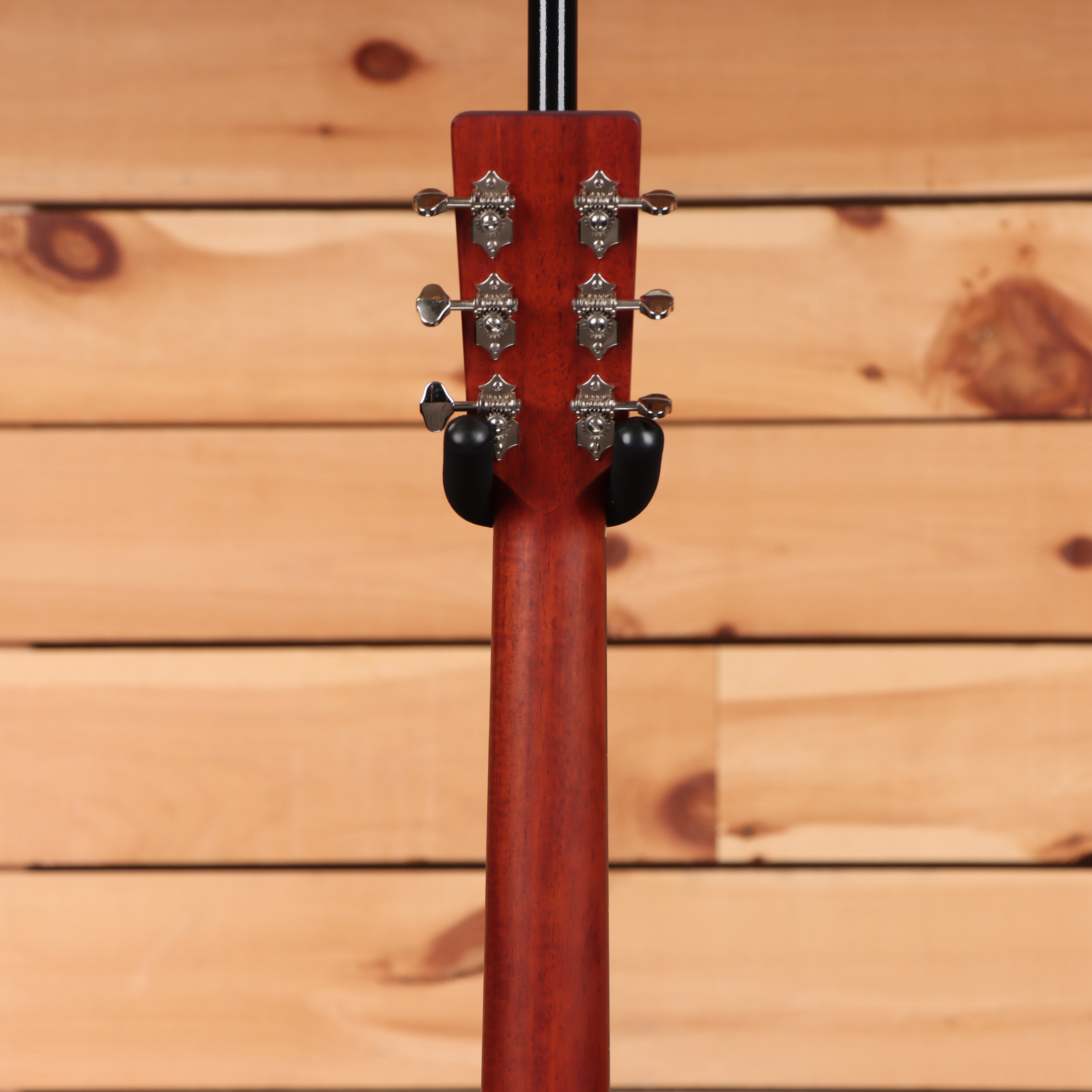Eastman E1OMCEdlx acoustic guitar natural finish with chrome tuning machines and cutaway body