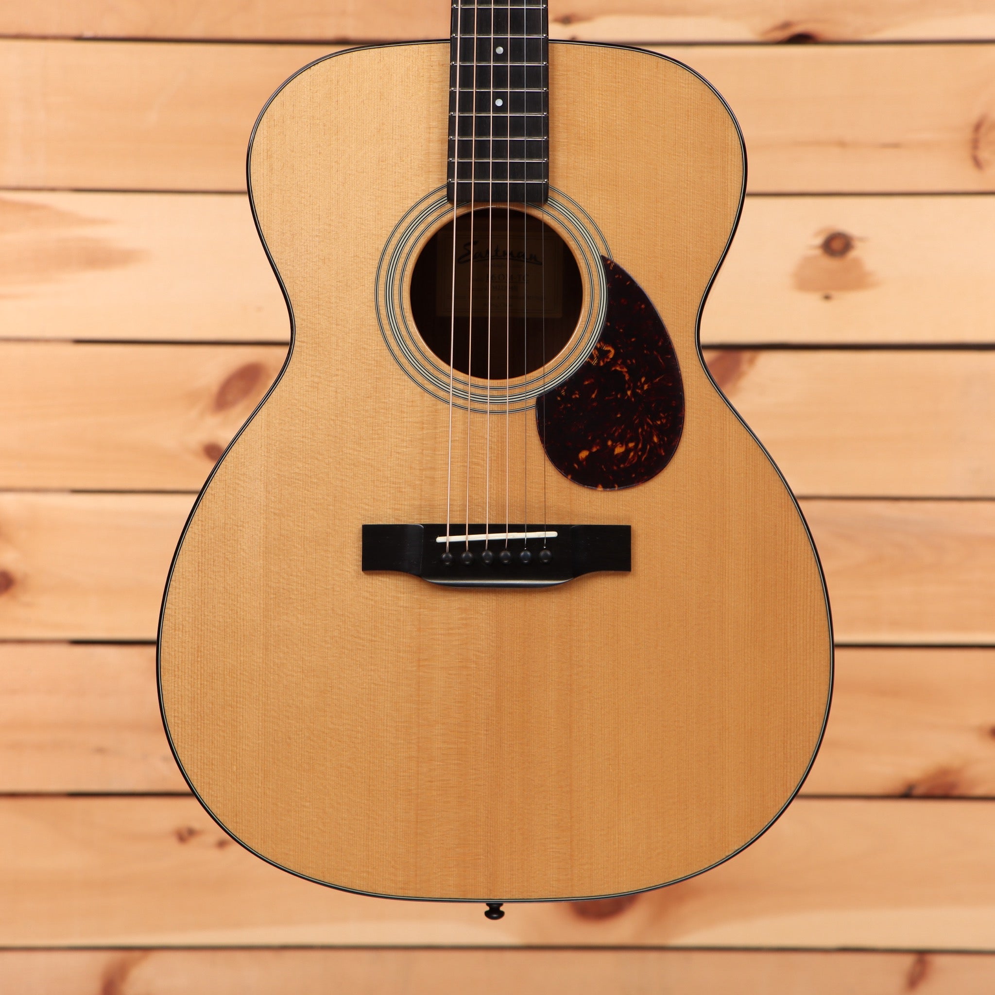 Eastman E6OMTC acoustic guitar natural finish with tortoiseshell pickguard and rosewood fretboard