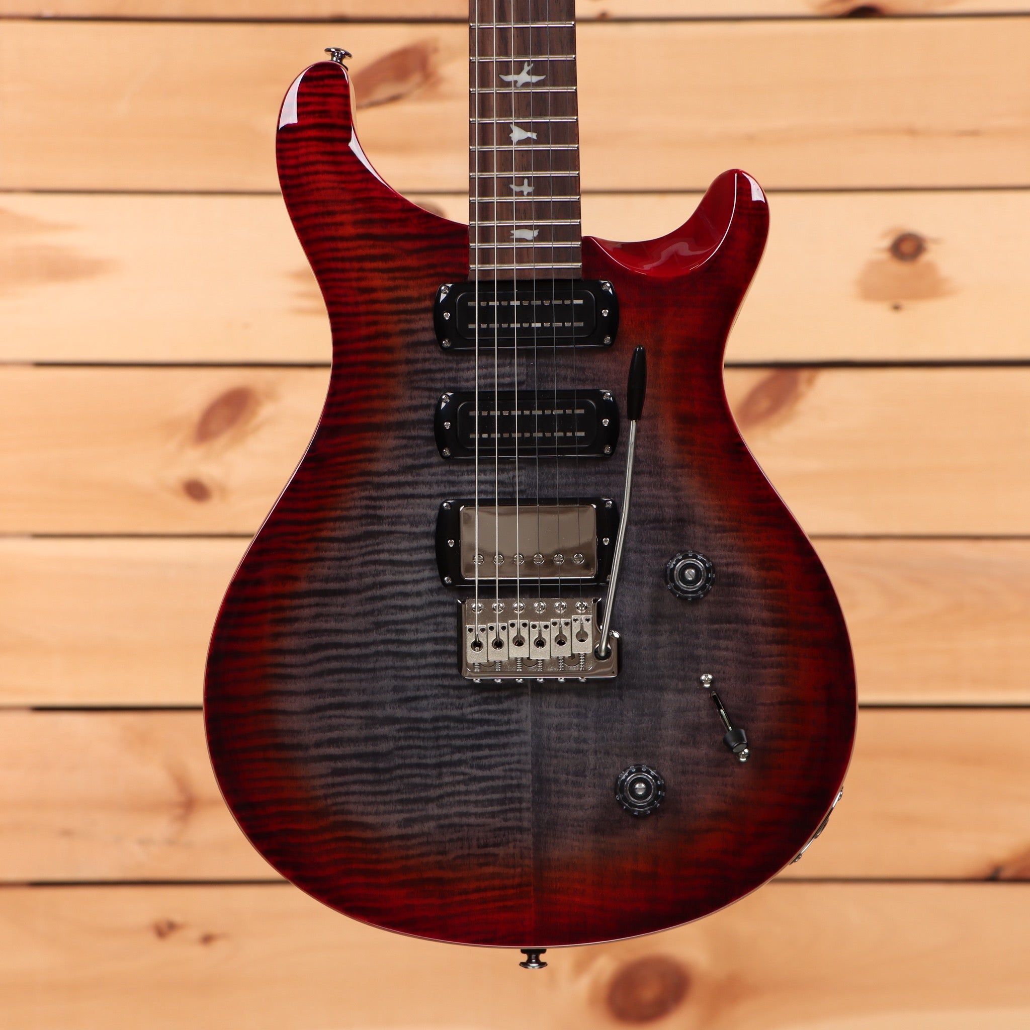 Paul Reed Smith SE Studio Charcoal Cherry Burst electric guitar with flame maple top and tremolo bridge