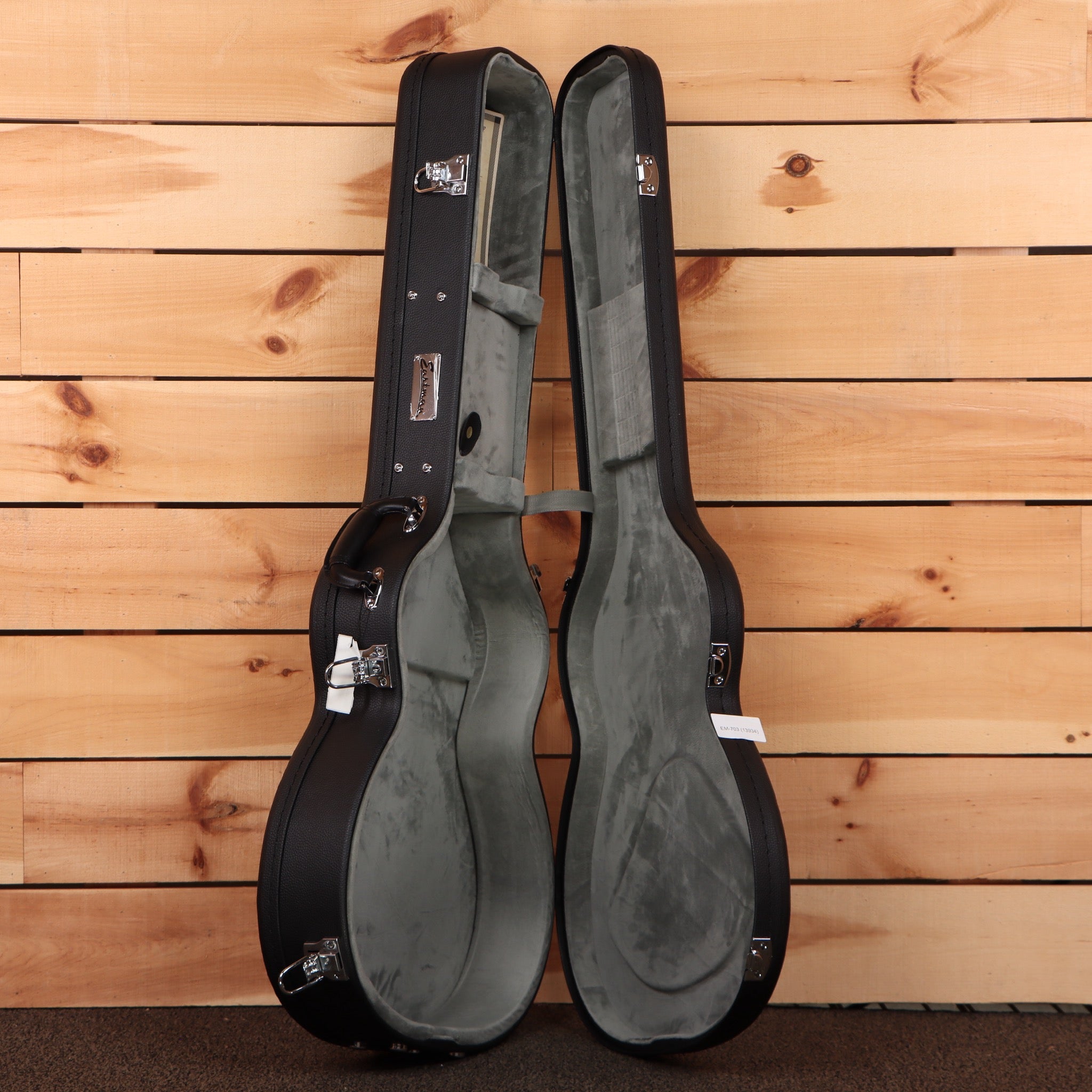 Eastman E60OMTC natural acoustic guitar hardcase with gray plush interior and chrome hardware