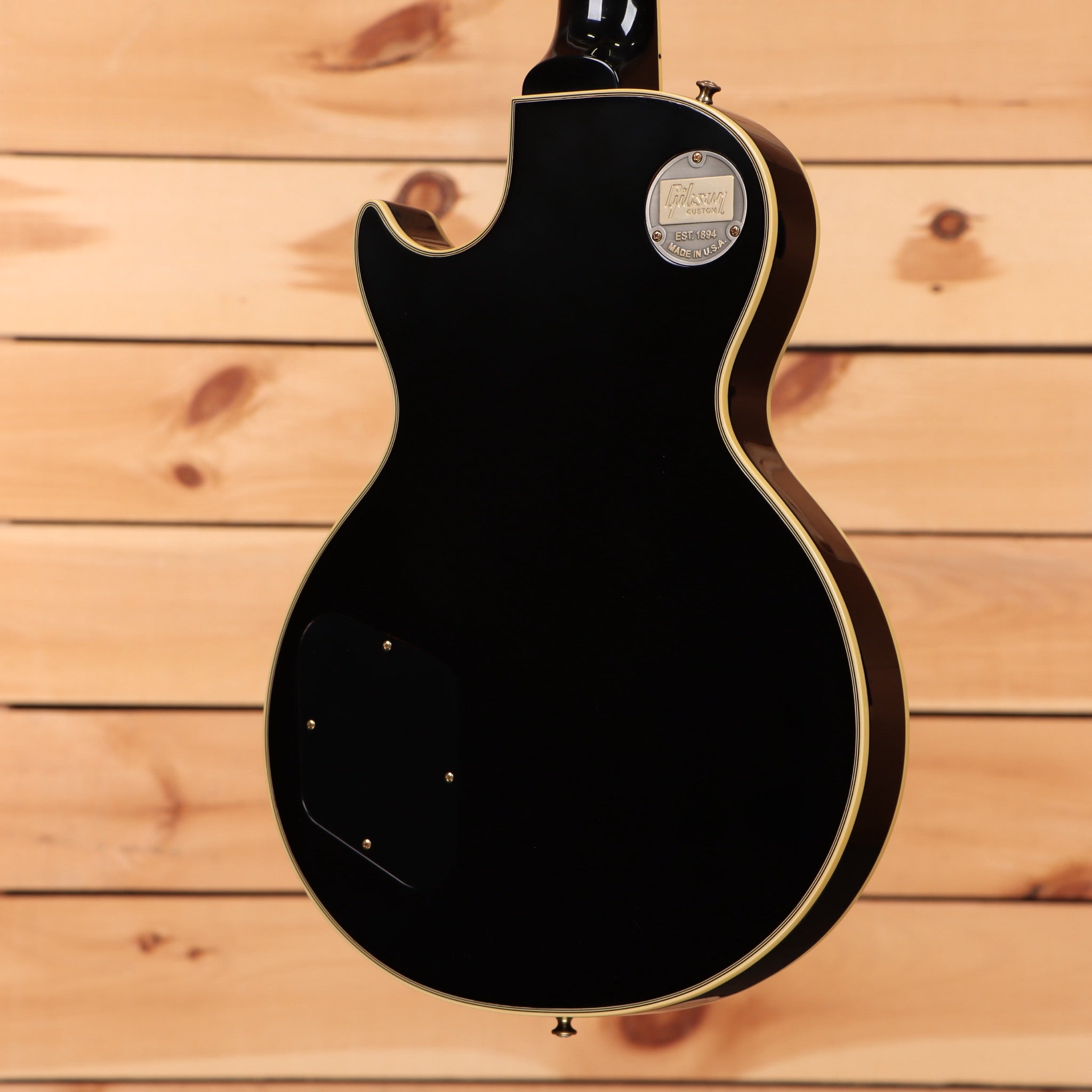 Pre-owned Gibson 1957 Les Paul Custom Reissue electric guitar Ebony VOS with gold binding and humbucker pickups