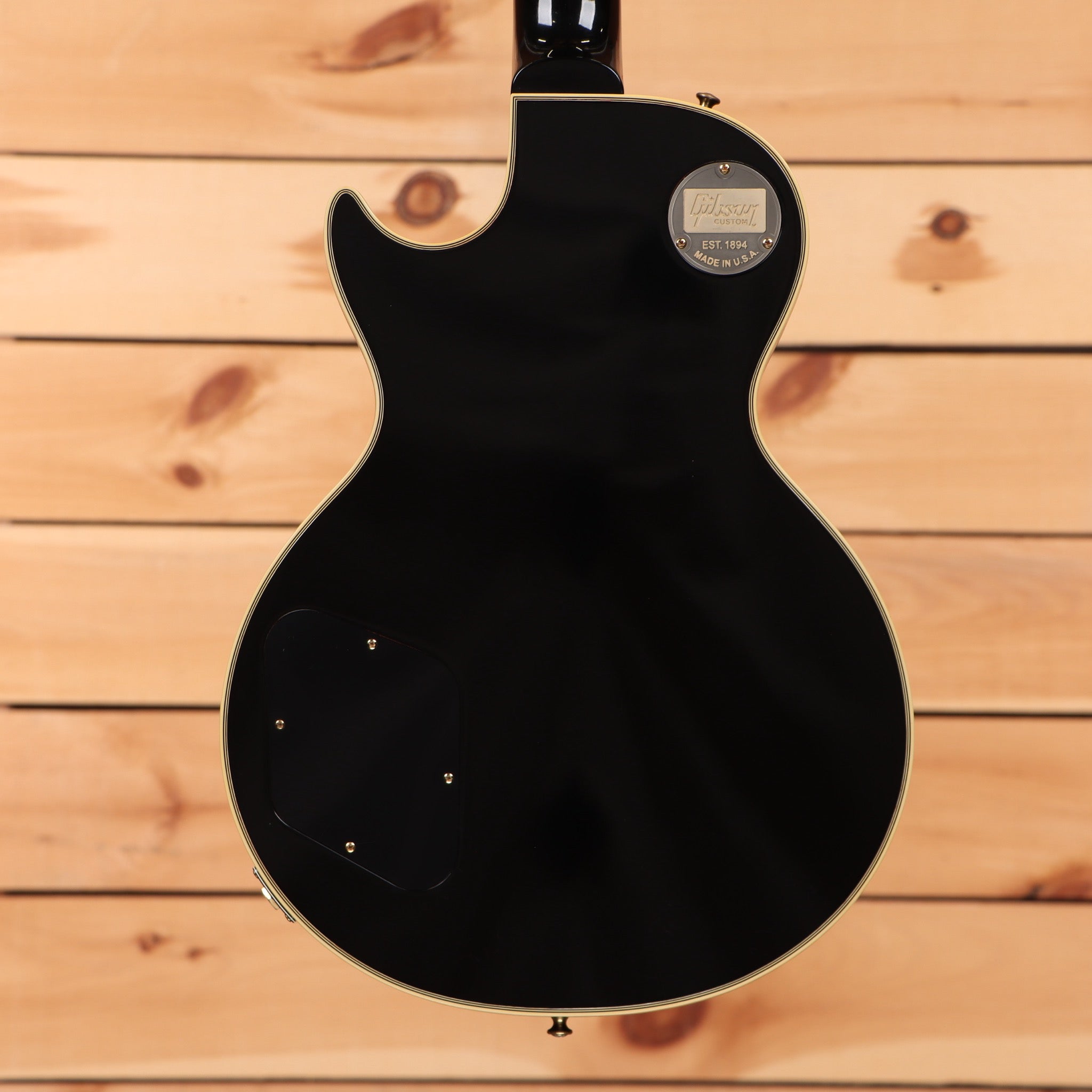 Pre-owned Gibson 1957 Les Paul Custom Reissue VOS electric guitar Ebony with gold hardware and binding