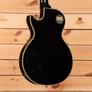 Pre-owned Gibson 1957 Les Paul Custom Reissue electric guitar Ebony VOS with gold binding and dual humbuckers