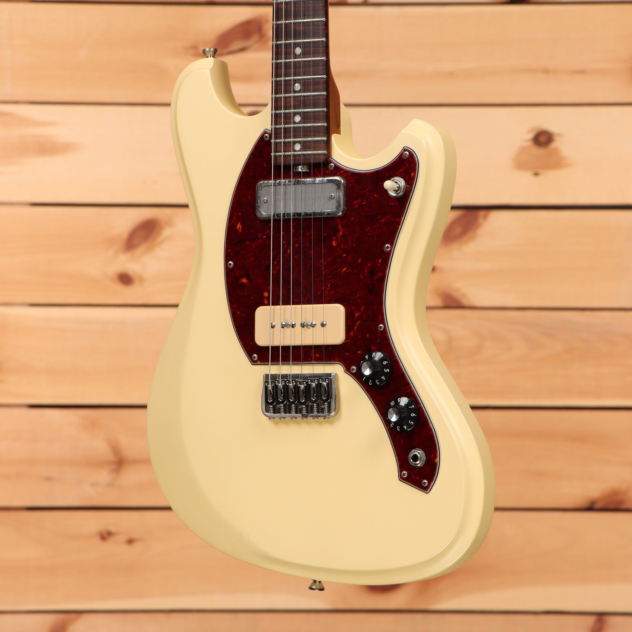 Treetone Stella electric guitar Vintage White with tortoiseshell pickguard and mixed P90 and humbucker pickups
