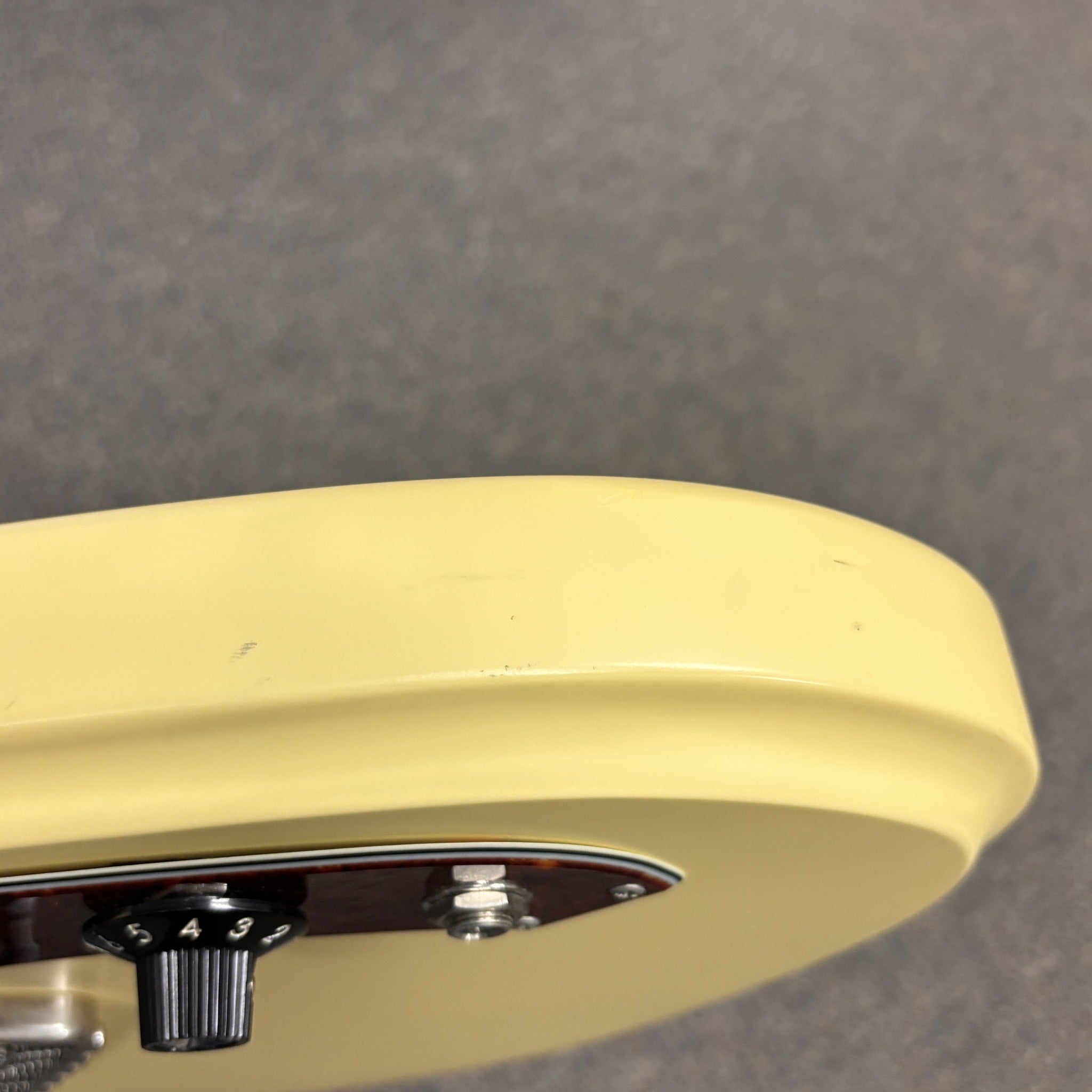 Treetone Stella electric guitar Vintage White finish with tortoiseshell pickguard and chrome controls detail view