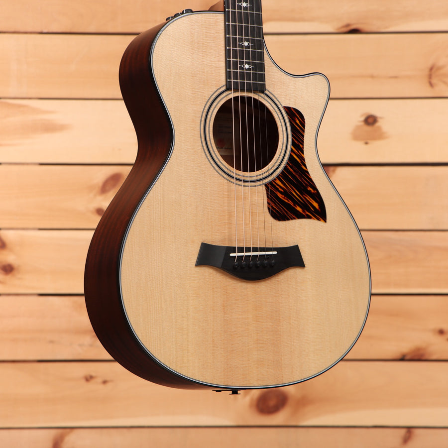 Taylor 312ce 12-fret natural acoustic guitar with venetian cutaway and tortoiseshell pickguard