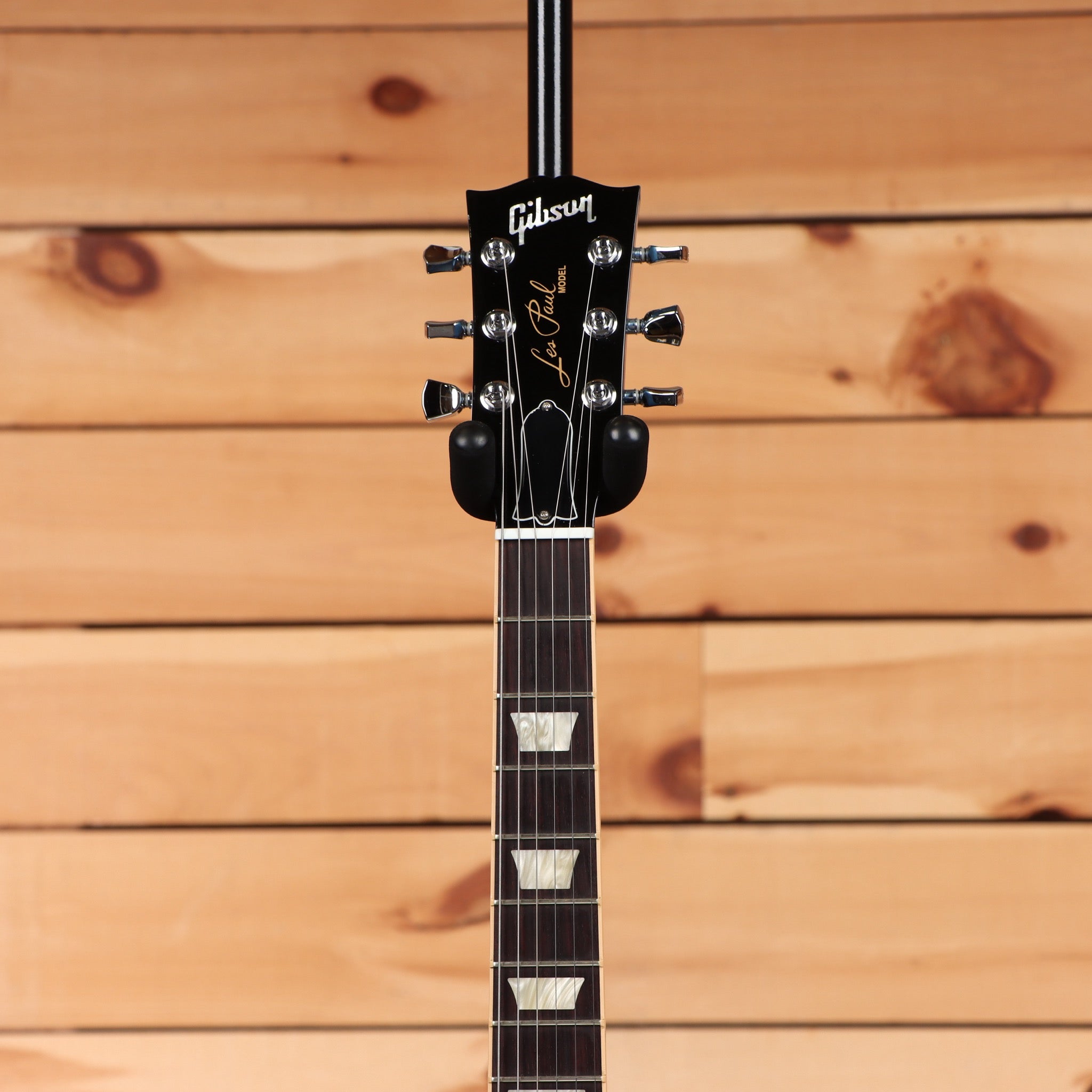 Gibson Les Paul electric guitar black headstock with chrome tuners and mother-of-pearl fret inlays