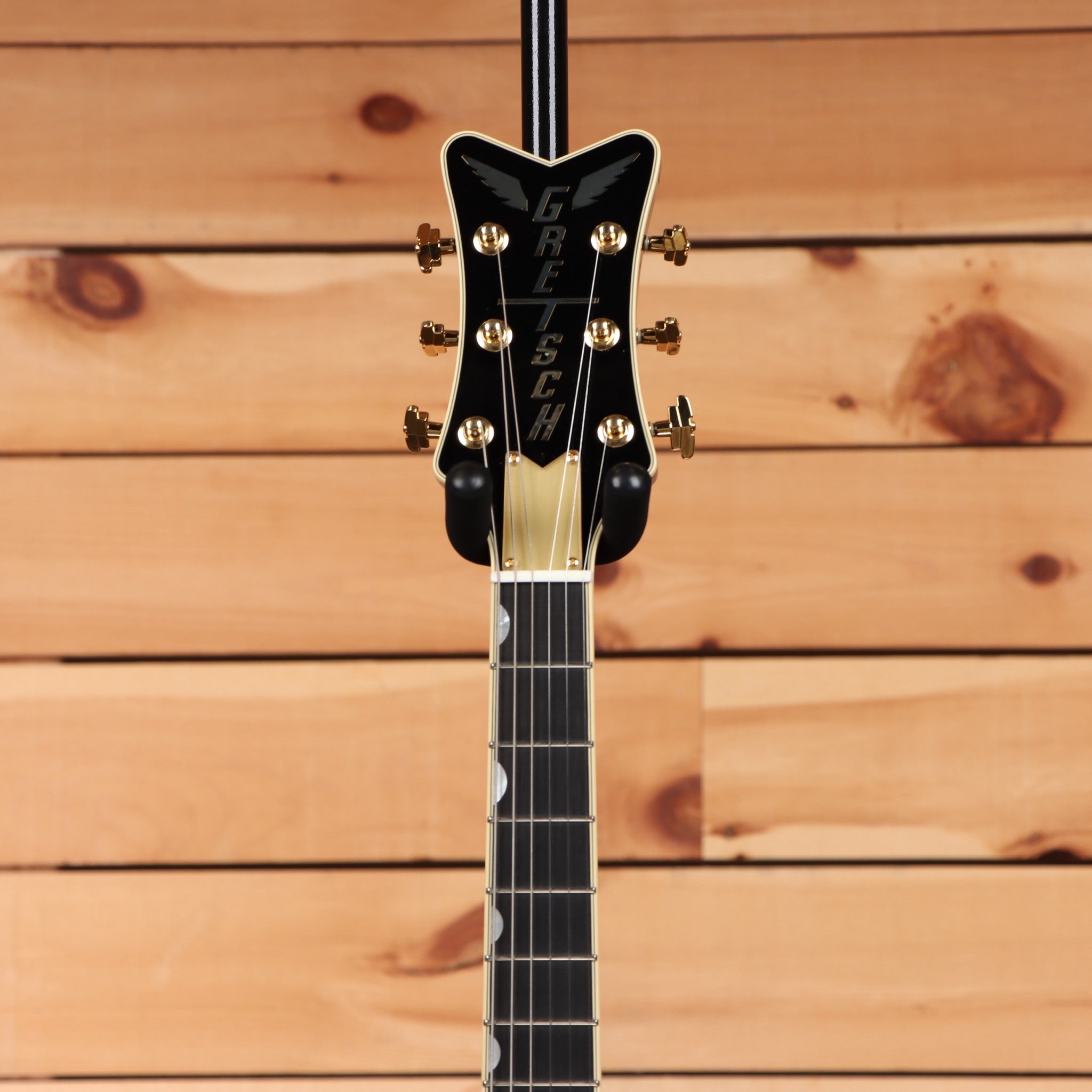 Gretsch Limited Edition Penguin Champagne Sparkle semi-hollow electric guitar with Bigsby tremolo and gold hardware