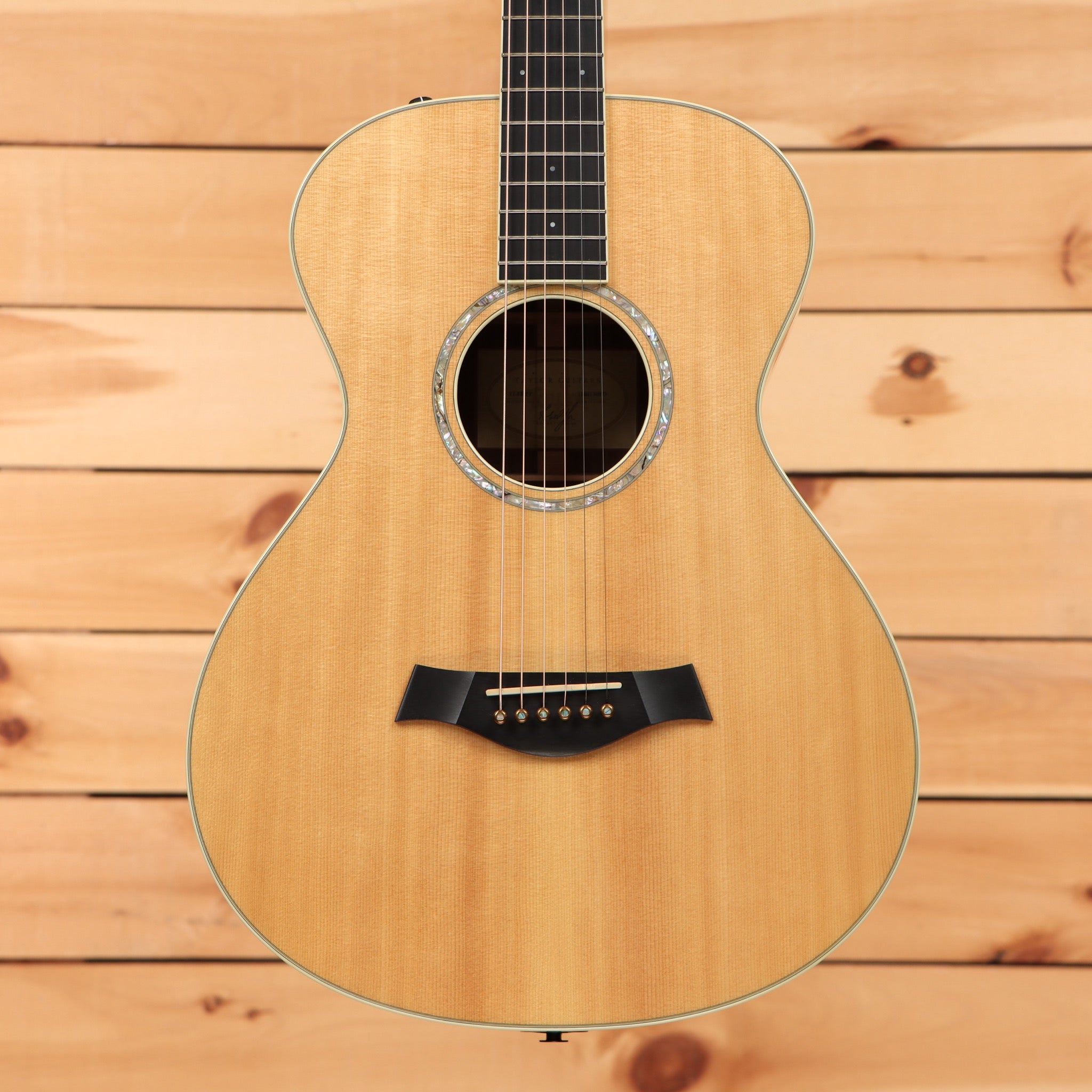 Taylor 12-Fret Grand Concert acoustic guitar natural finish pre-owned with black pickguard