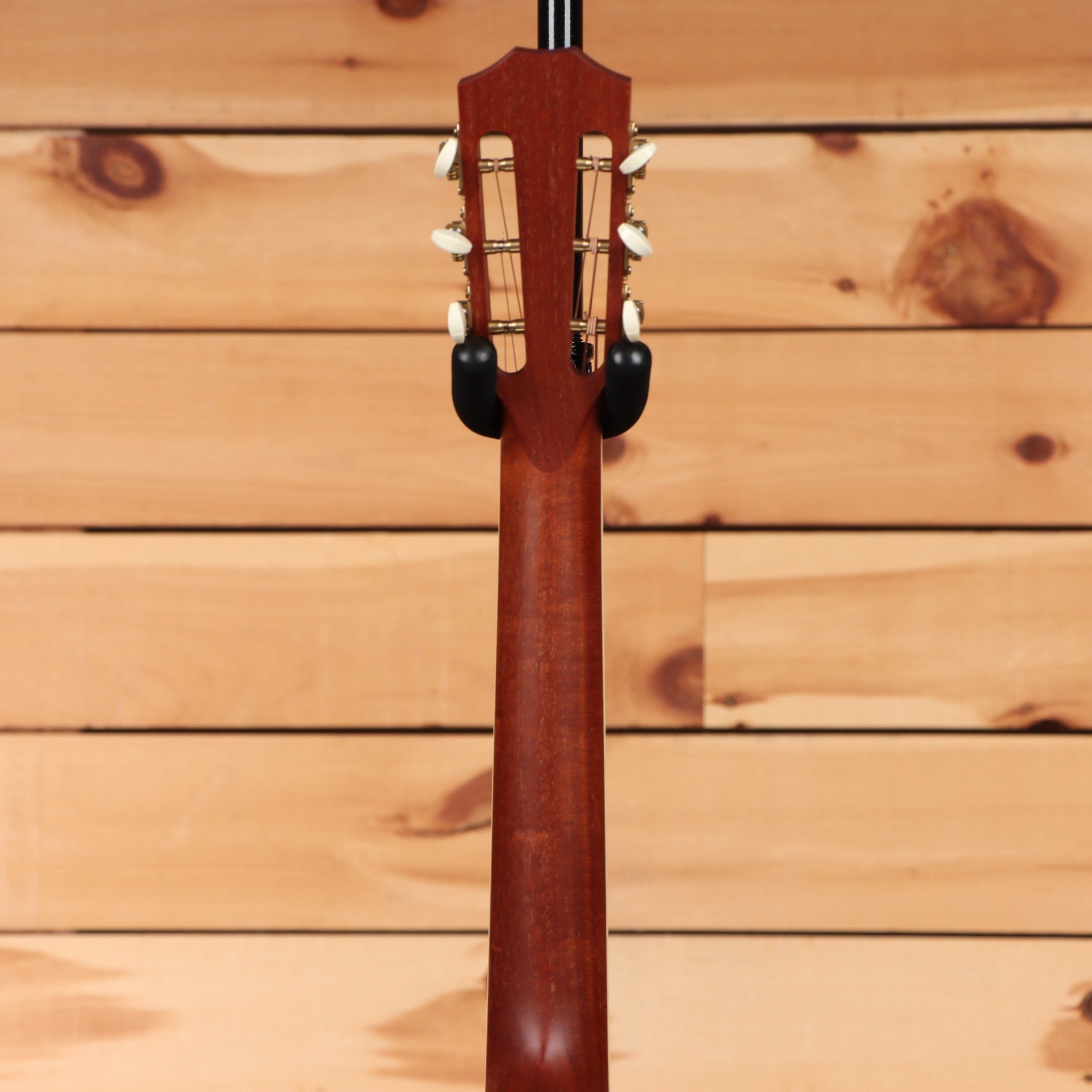 Pre-owned Taylor 12-fret classical acoustic guitar natural finish with slotted headstock