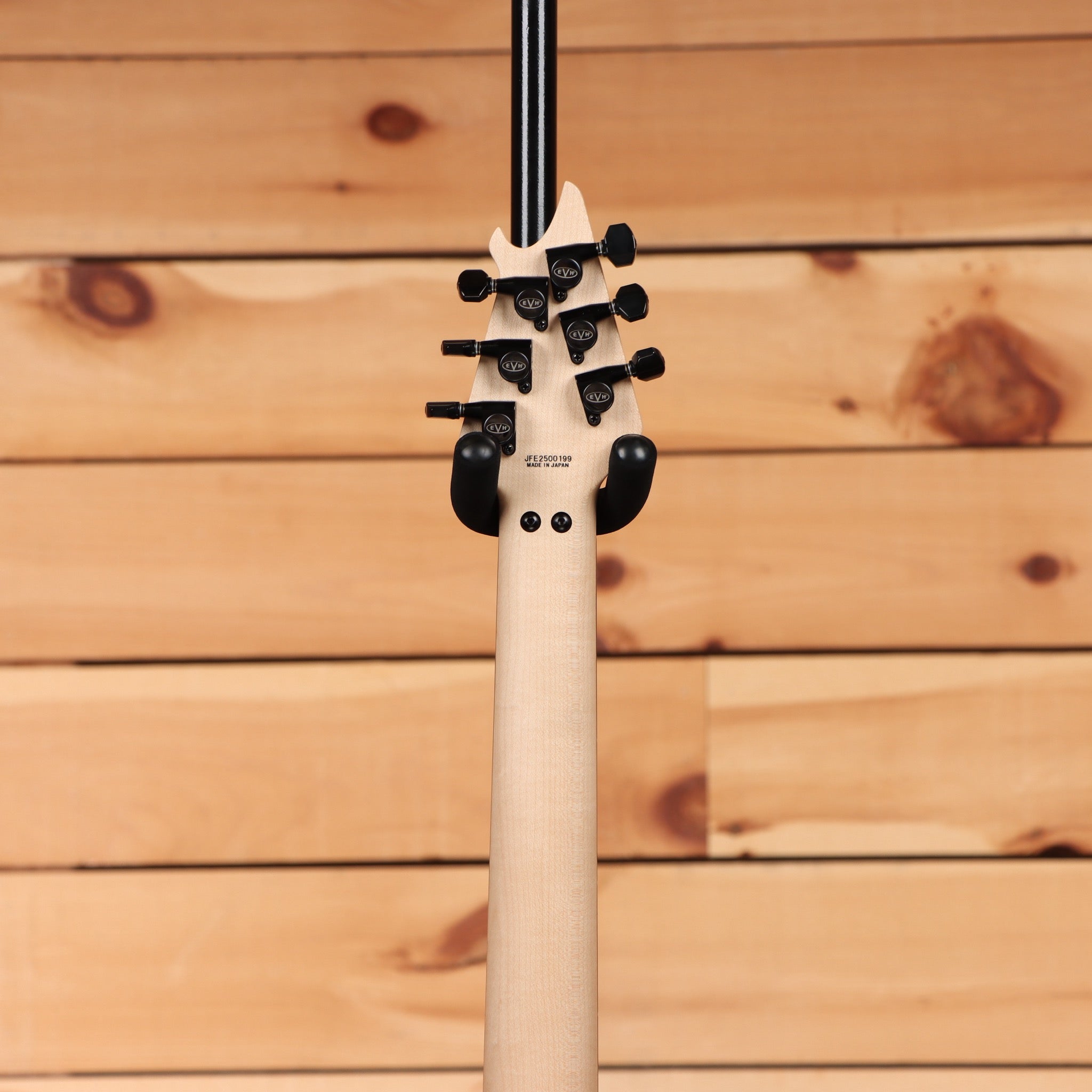 EVH Made in Japan Series Wolfgang Stealth electric guitar with white headstock and black hardware