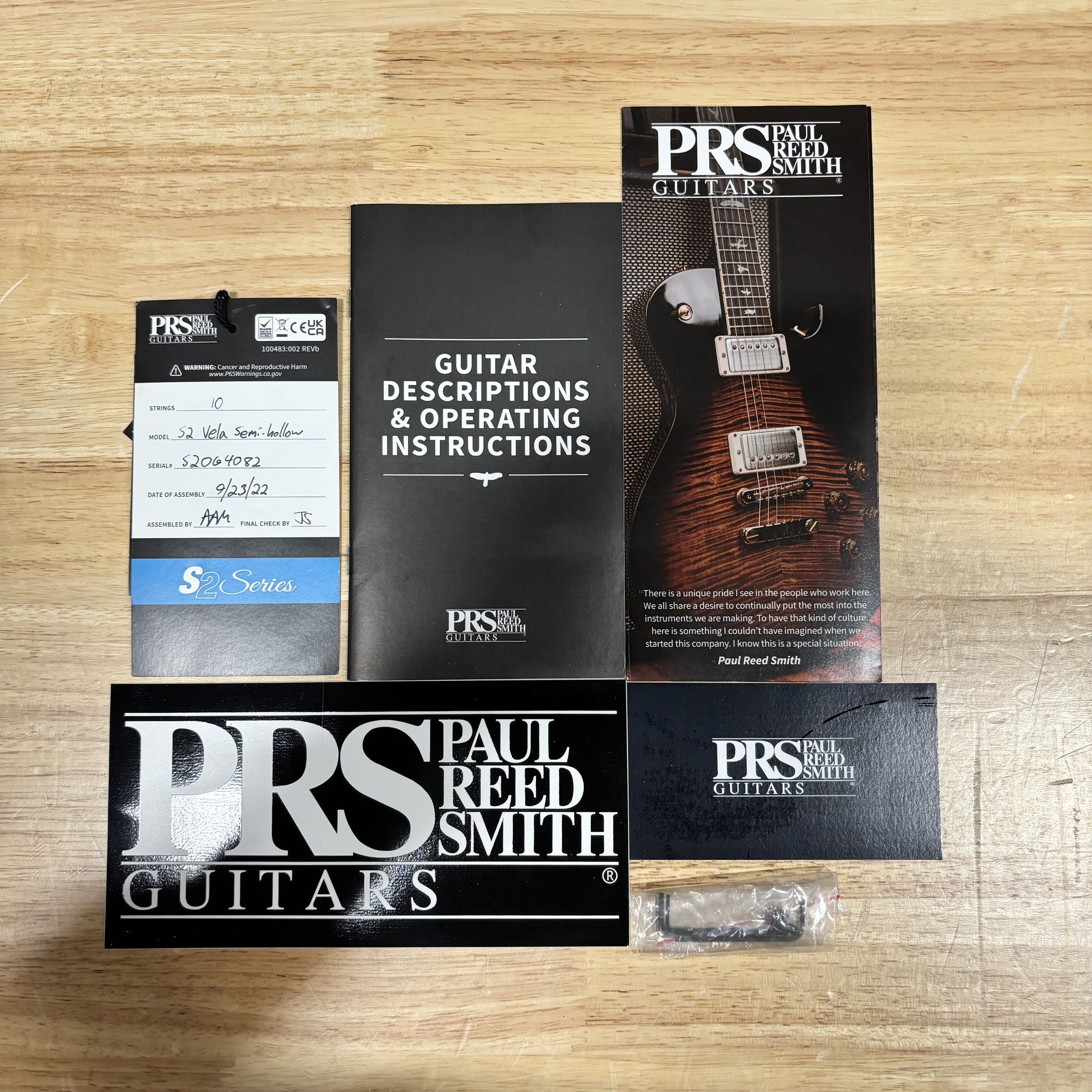 PRS Paul Reed Smith S2 Vela Semi-Hollow McCarty Burst accessories pack with manual, hang tag, sticker, and hardware