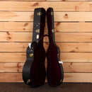 Martin CEO-7 acoustic guitar hardshell case black exterior with burgundy velvet interior and gold hardware latches