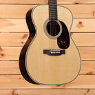 Martin 00-28 Modern Deluxe acoustic guitar natural finish with tortoiseshell pickguard and binding detail