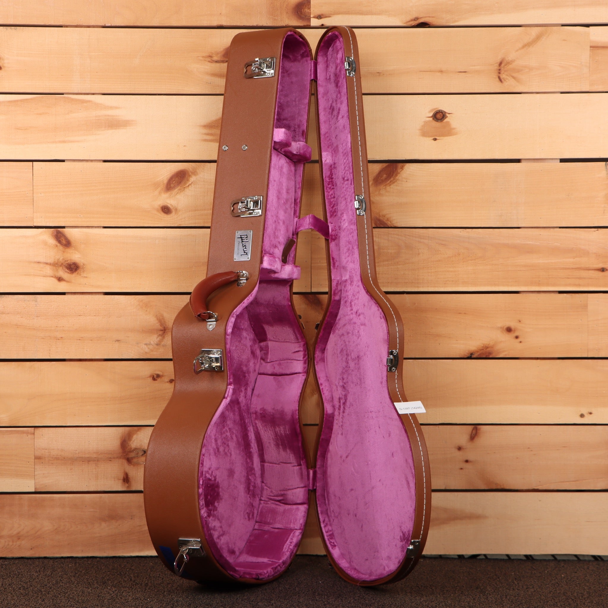 Gibson SJ-200 True Vintage acoustic guitar case brown hardshell with purple velvet interior open