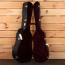 Martin 2026 NAMM Custom dreadnought acoustic guitar case with burgundy velvet interior and gold hardware