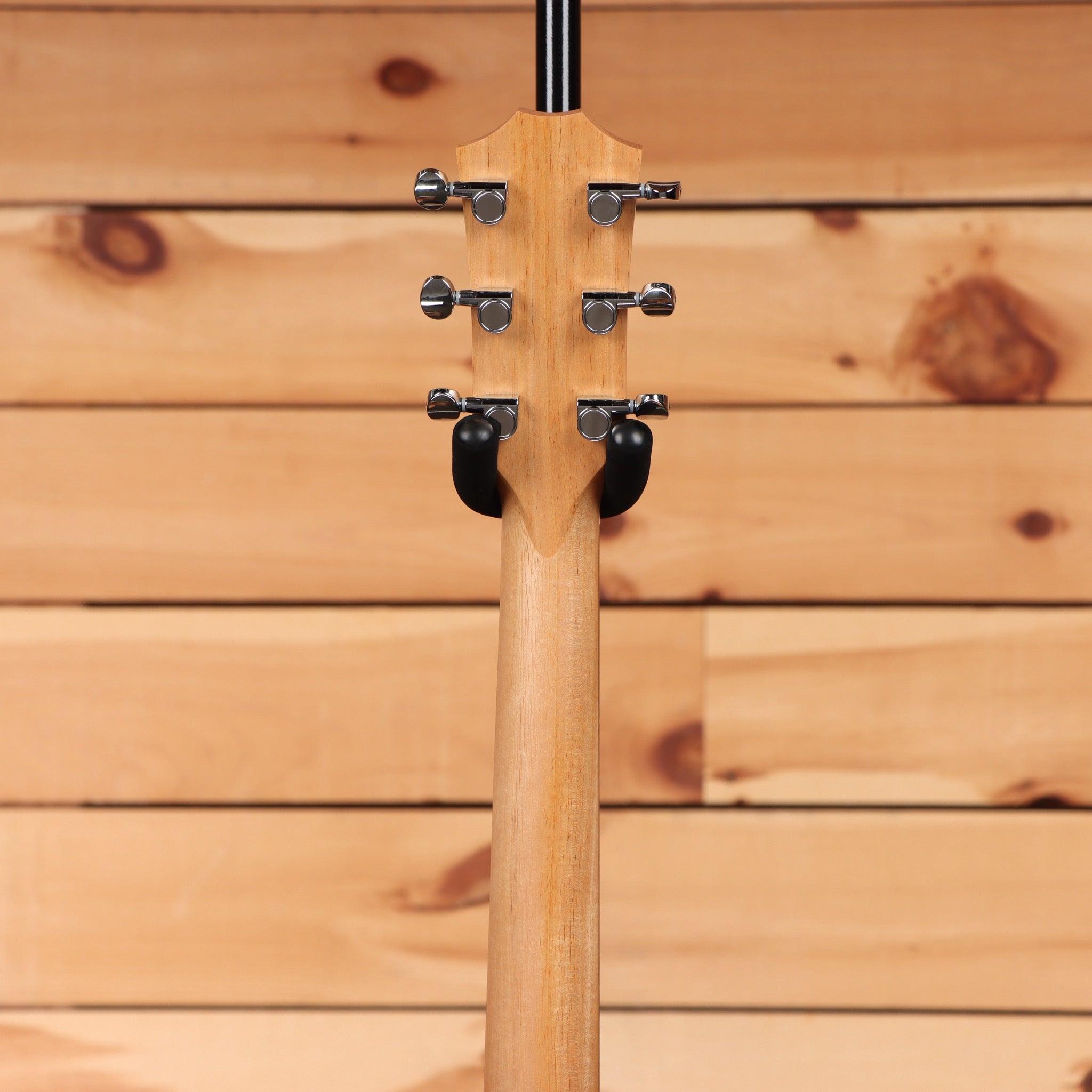 Taylor BBTE natural acoustic bass guitar with chrome tuning machines and black strap buttons