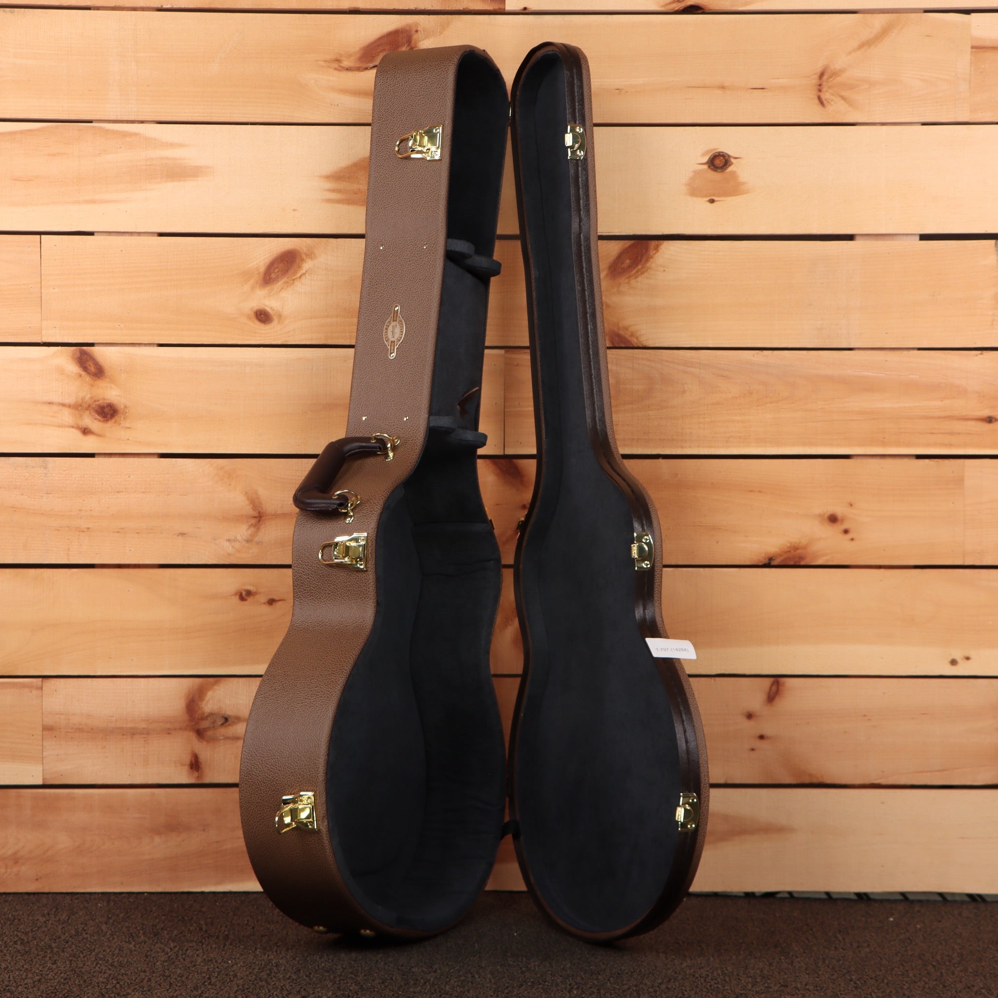 Taylor 814e Gold Label hardshell guitar case brown exterior black interior with gold latches open view